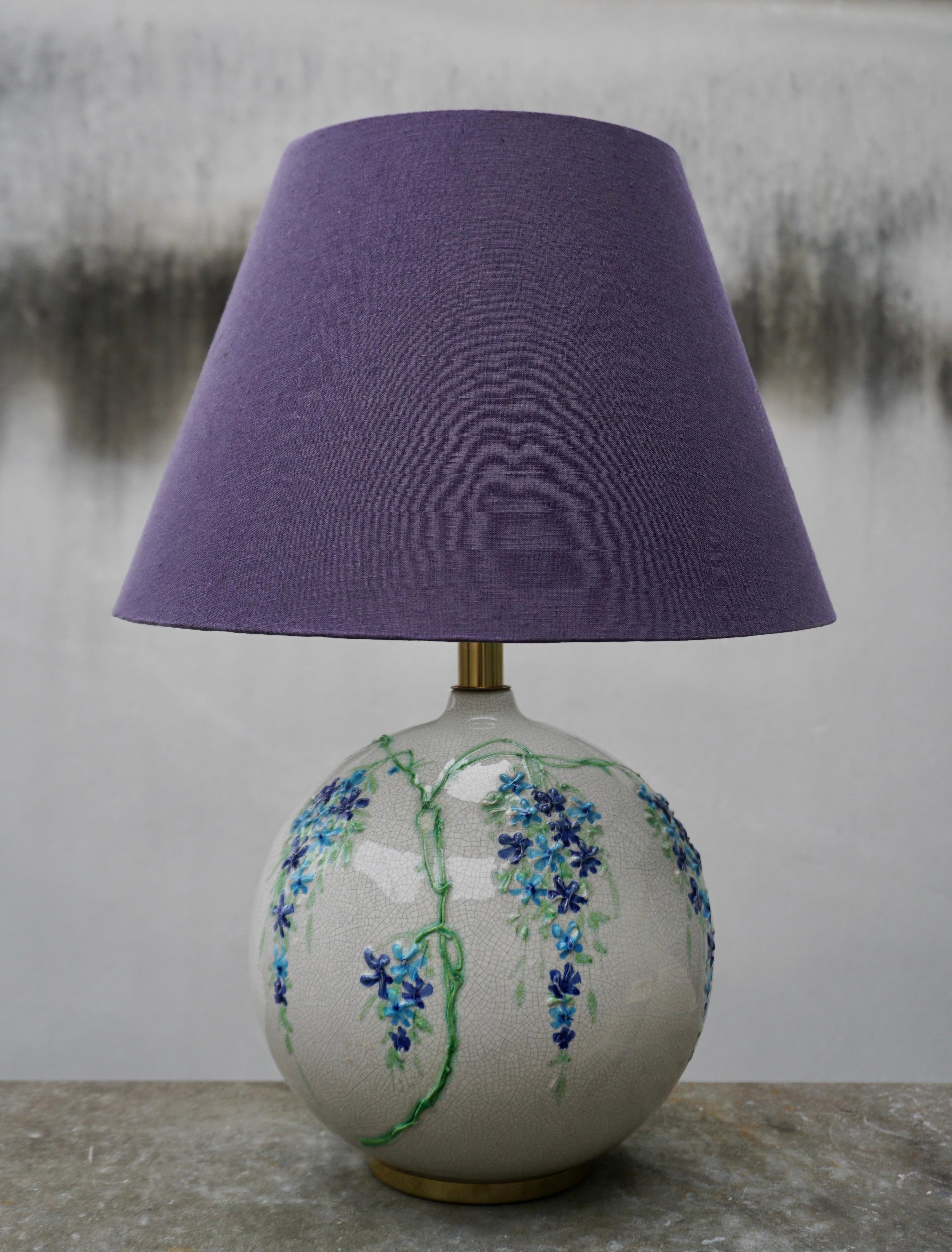 This elegant table lamp was designed by Alvino Bagni and produced by his company Bagni in Italy in the 1970s. The spherical shape in glazed ceramic was made entirely by hand on a lathe. New custom shade with linen texture in a purple blue color