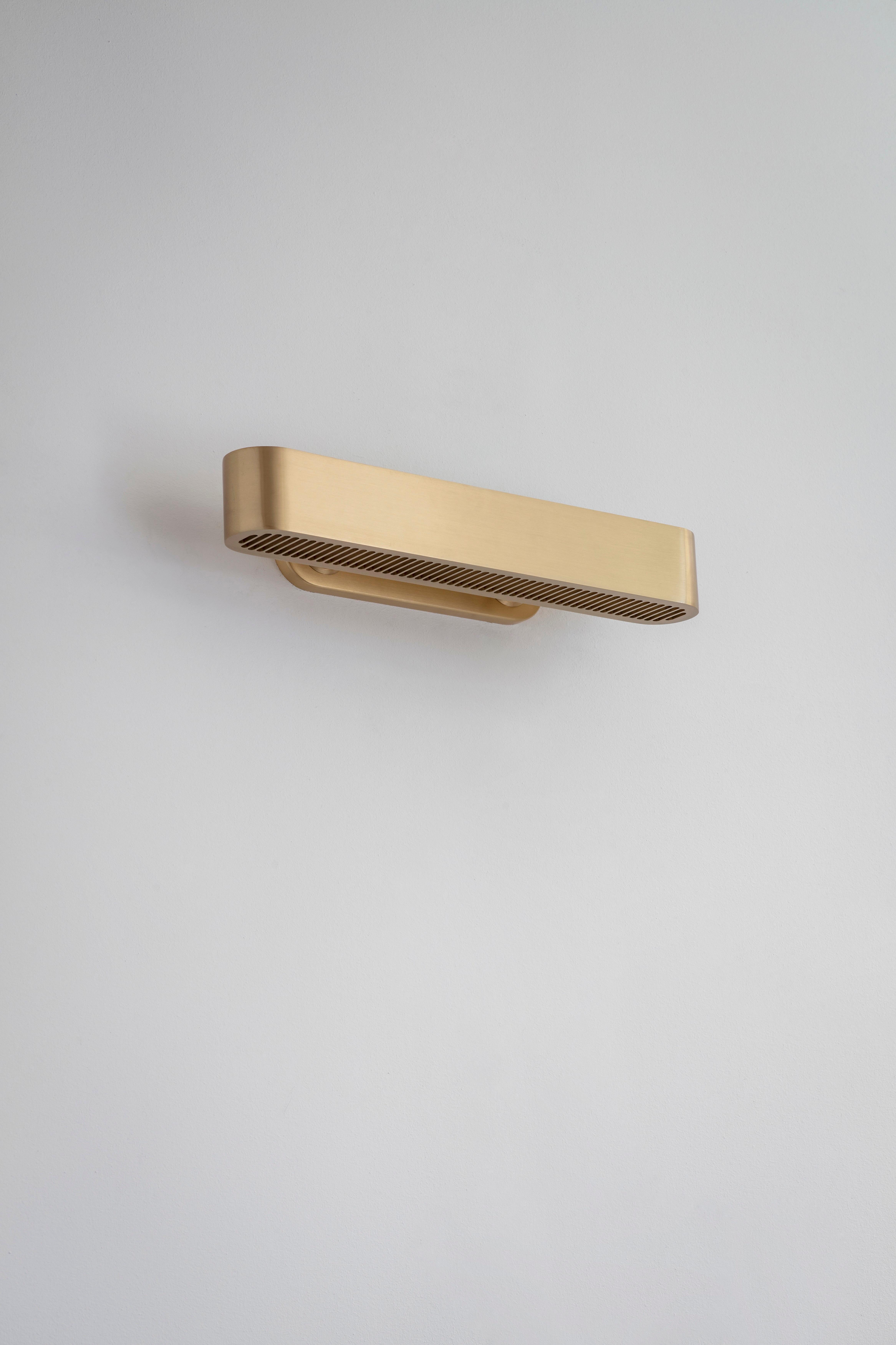 Colt wall light flush by Bert Frank
Dimensions: 9.7 x 40.2 x 6 cm
Materials: Brass, bronze

Brushed brass lacquered as standard, custom finishes available.

The Bert Frank aesthetic is one of subtle quirks and twists. Asymmetry is one of