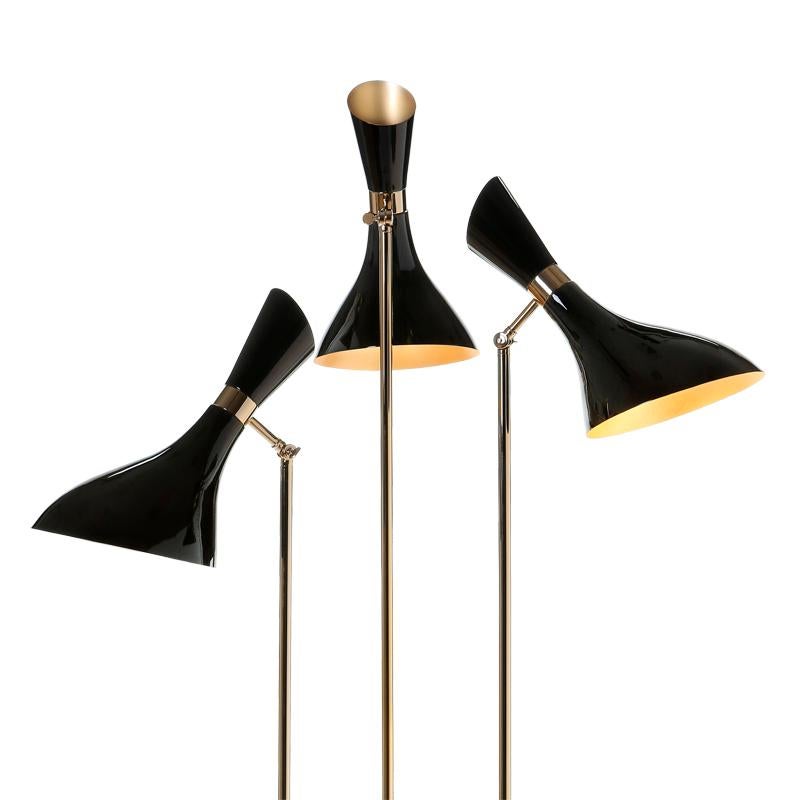 Floor lamp Coltrane with structure in solid brass in
gold finish. With 3 black lacquered brass shades.
With 3 bulbs, lamp holder type E14, max 40 Watt.
Bulbs not included.
Also available in Coltrane table or wall lamp.