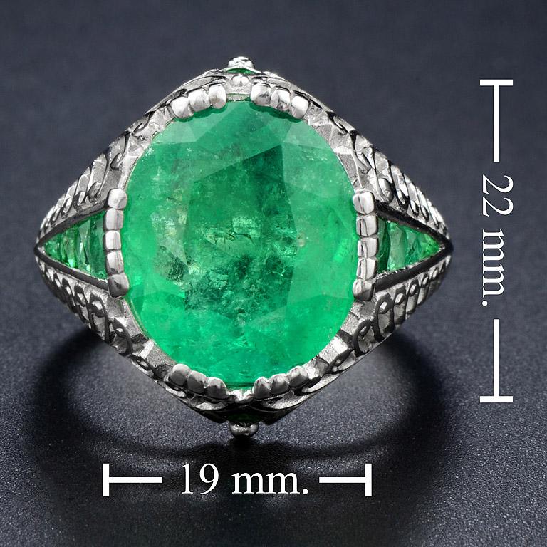 Columbia Emerald 6.983 carat (Oval Shape, Fancy Cut, Green Color), we have got it since 2016 and we have made especially for this design. We match recut Emerald 12 pcs. 1.2 carat that they are good quality too. So you should have this ring for your