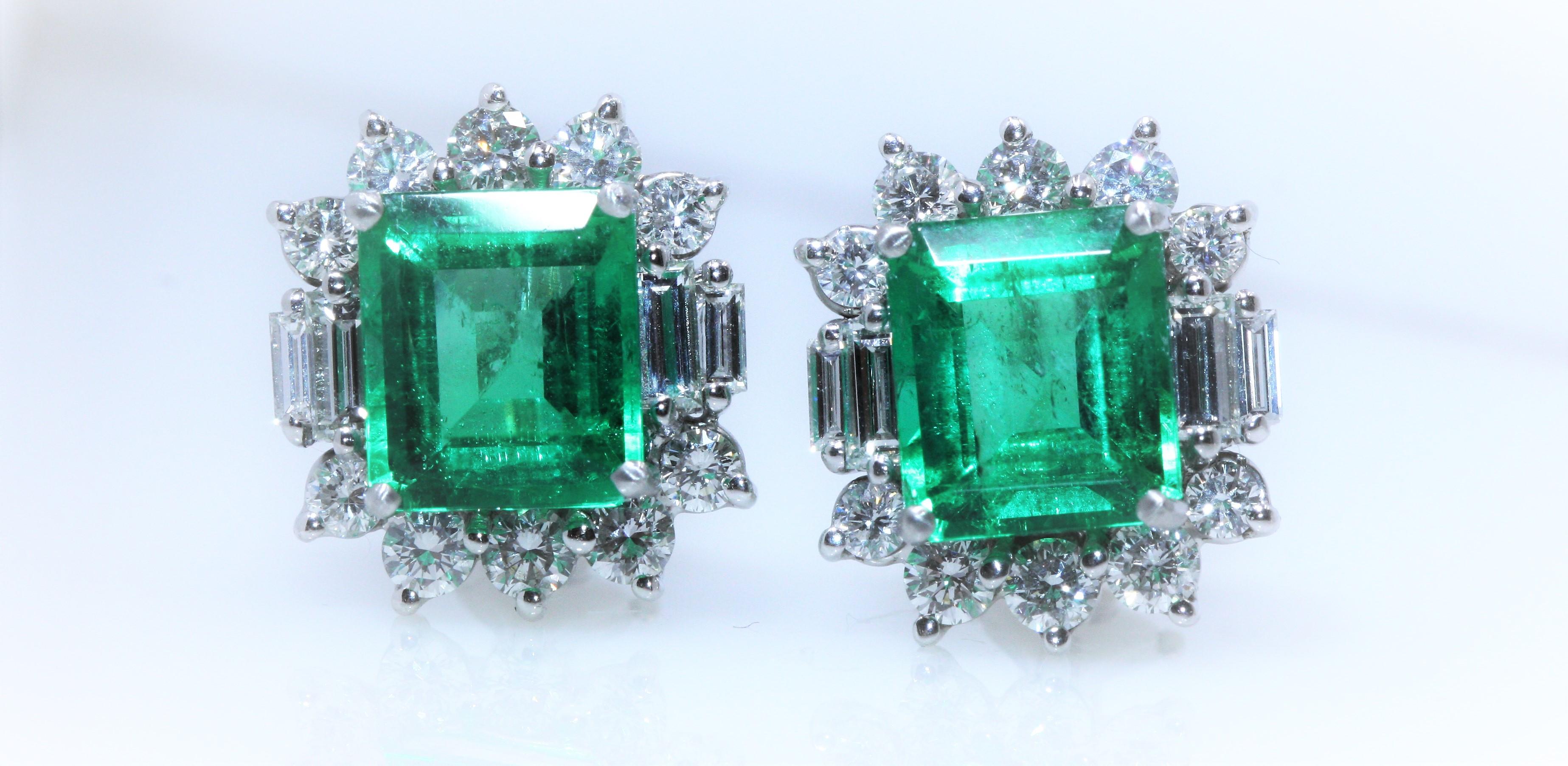 Columbia Emerald White Gold Diamond Earrings  insignificant oil
Comments: Two gemstones set in a pair of white metal earrings with several round and baguette diamonds.
Measurements: Approx. 9.30 x 8.06 x 5.53 and 9.27 x 8.04 x 5.31 mm
Shape: