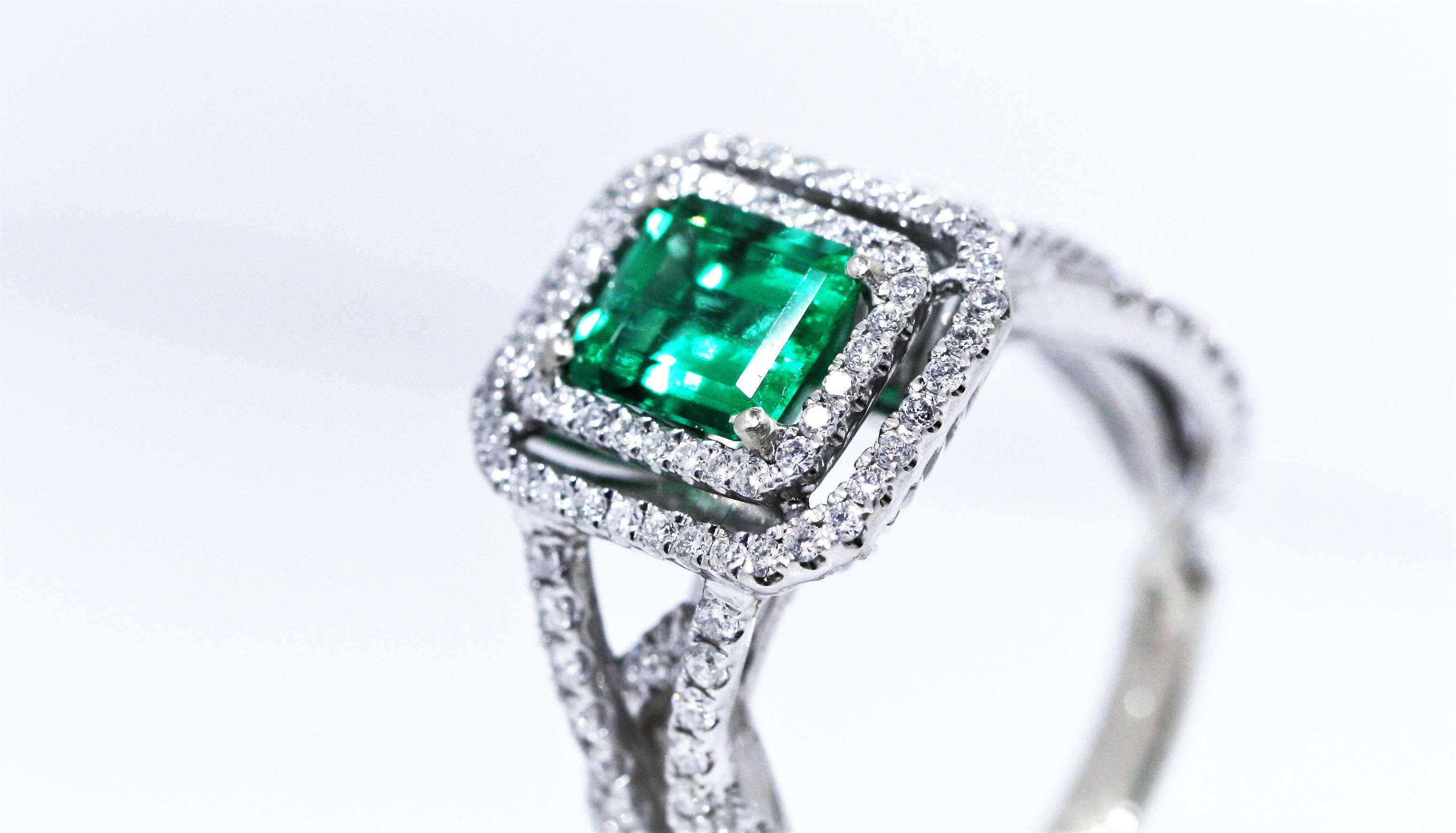 The Rectangular cut split shank halo emerald ring is made of 18K white gold. The Rectangular cut emerald weighs 1.15 carats. The ring also features prong-set round cut diamonds.

Comments: Set in a white metal ring with numerous round diamonds