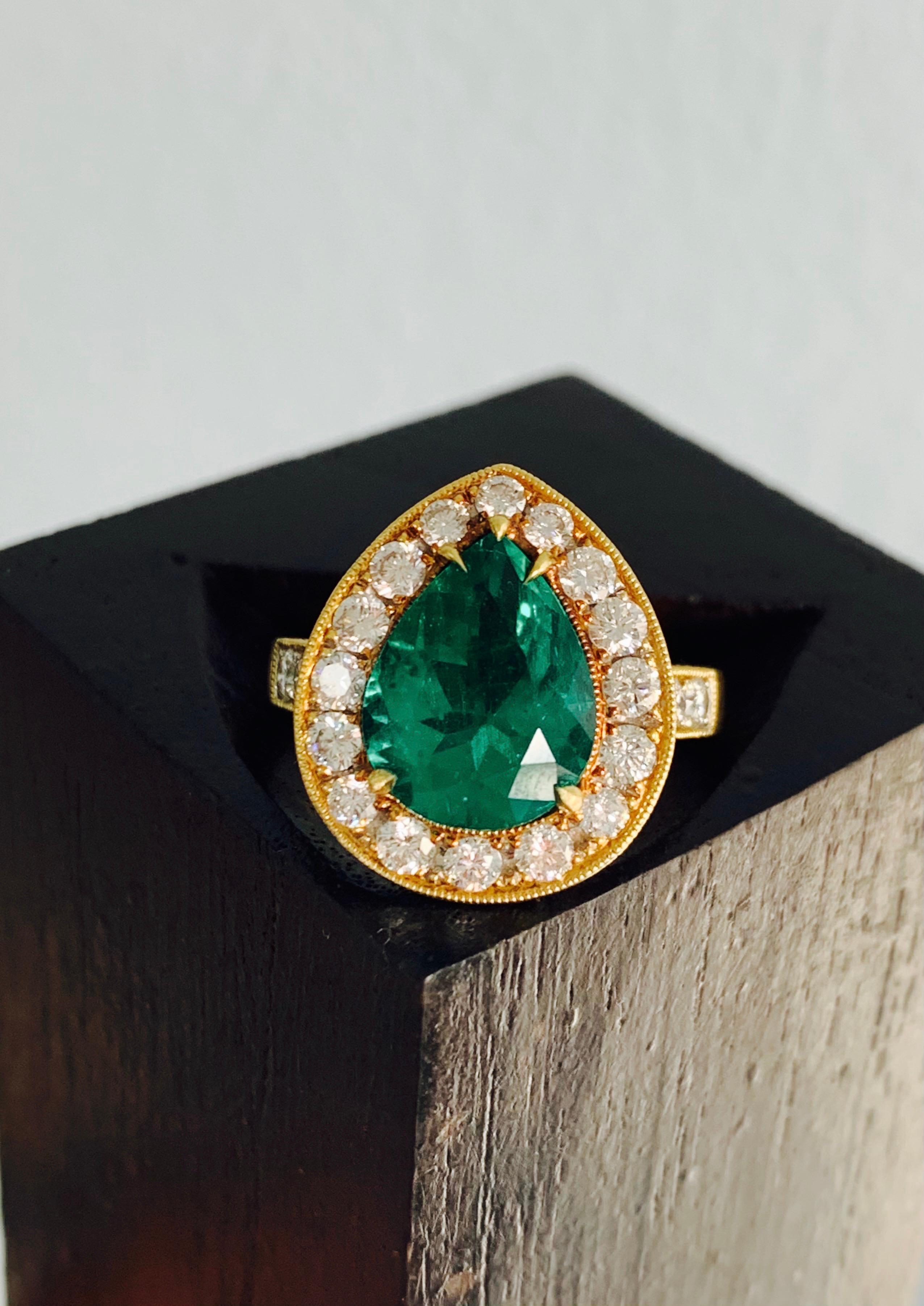 An extraordinary vivid green emerald displays an incredible depth of color and brilliance in this eye-catching ring.
The details are as follows : 
Emerald weight : 3.25 carat ( vivid green color) 
Diamond weight : 1.01 carat ( GH color)
Metal : 18K
