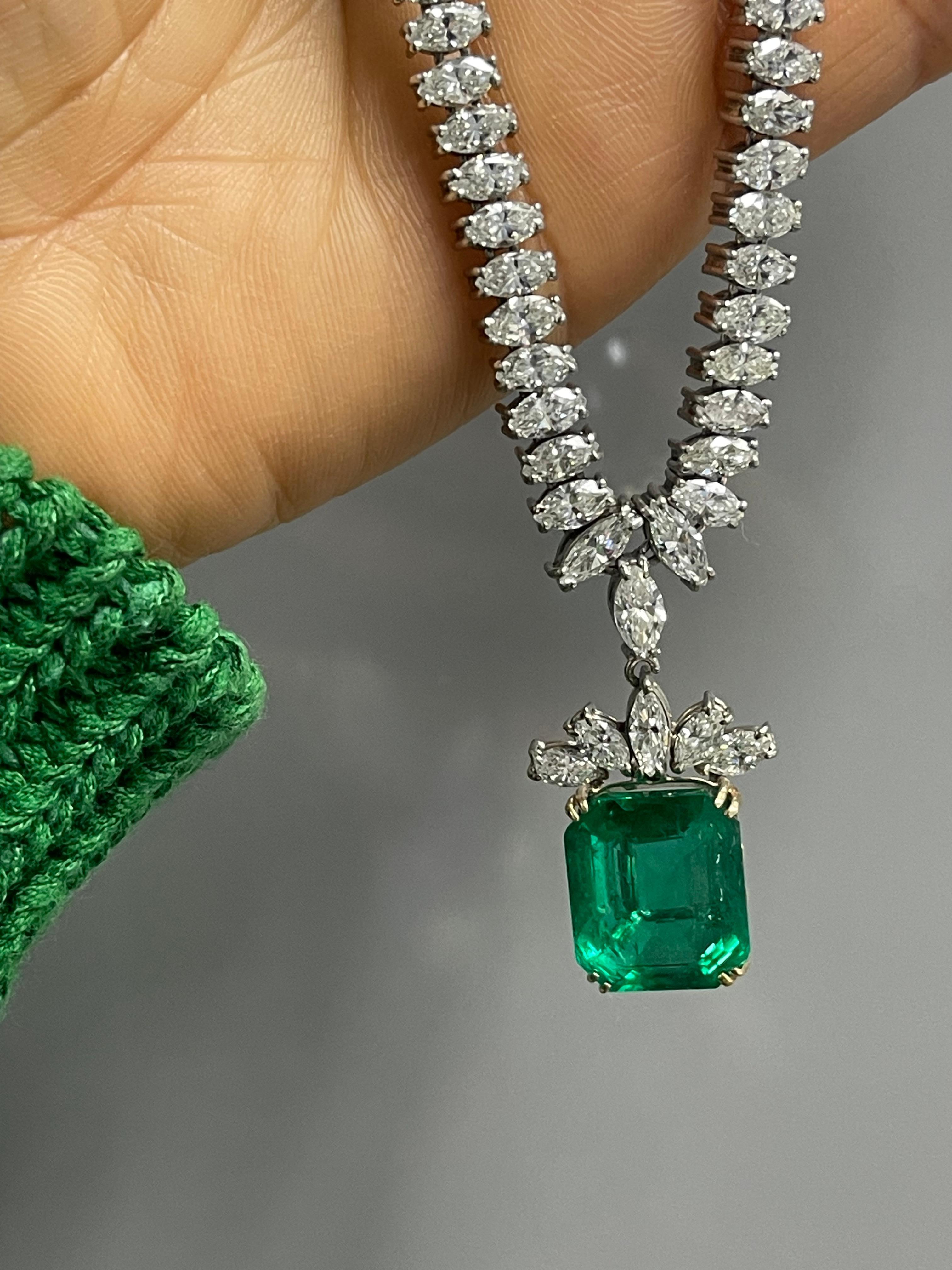 Absolutely stunning Columbian Emerald minor oil and diamond necklace in Platinum, Gubelin Certified. 

The details are as follows: 

Emerald weight : 13.90 carats 

Diamond weight : Marquise: 8 carats approximately 
Diamond weight : Round : 0.25