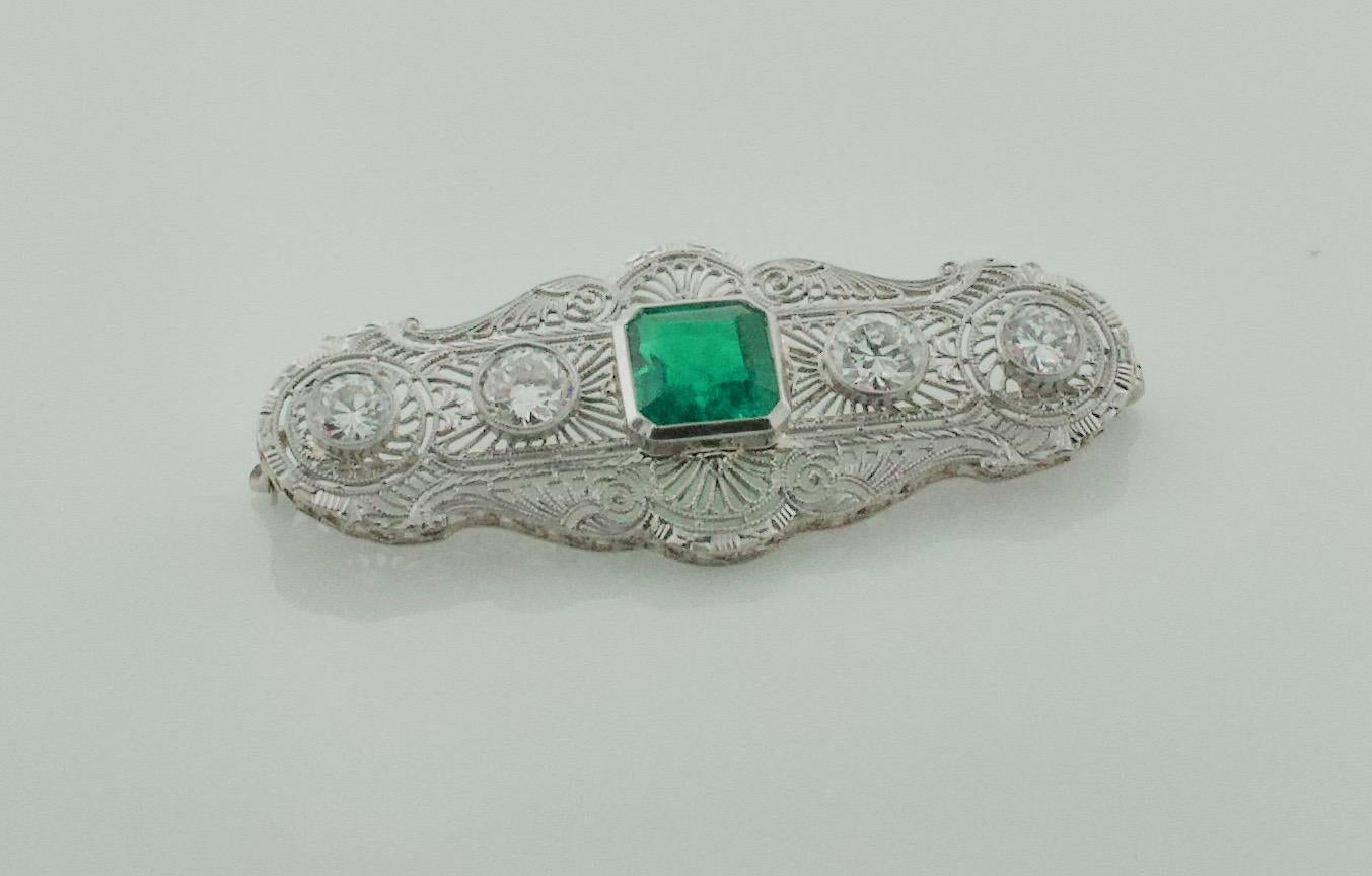 Colombian Emerald and Diamond Brooch c. 1920's GIA Certified 
One Emerald Cut Emerald 3.50 carats approximately GIA Certified Colombian with The Minor Treatment.  [The Emerald has been in The Mounting Since It's Original Construction in The 1920's