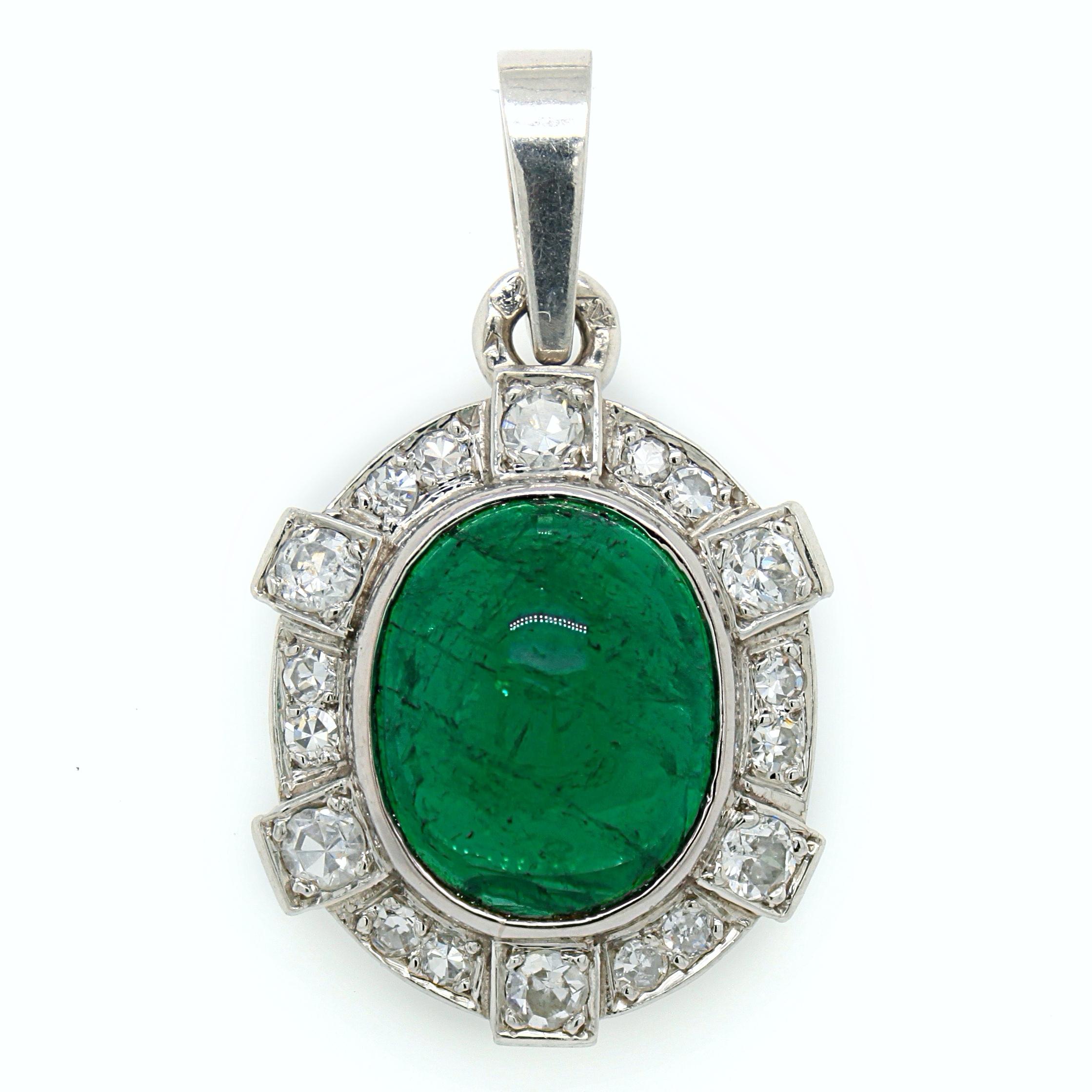 An Art Deco emerald and diamond pendant in platinum, France, ca. 1920s. The emerald cabochon weighs approximately 4.8 carats and is of Columbian origin, accompanied by a short gemological report. It has a vibrant green colour and a very lively
