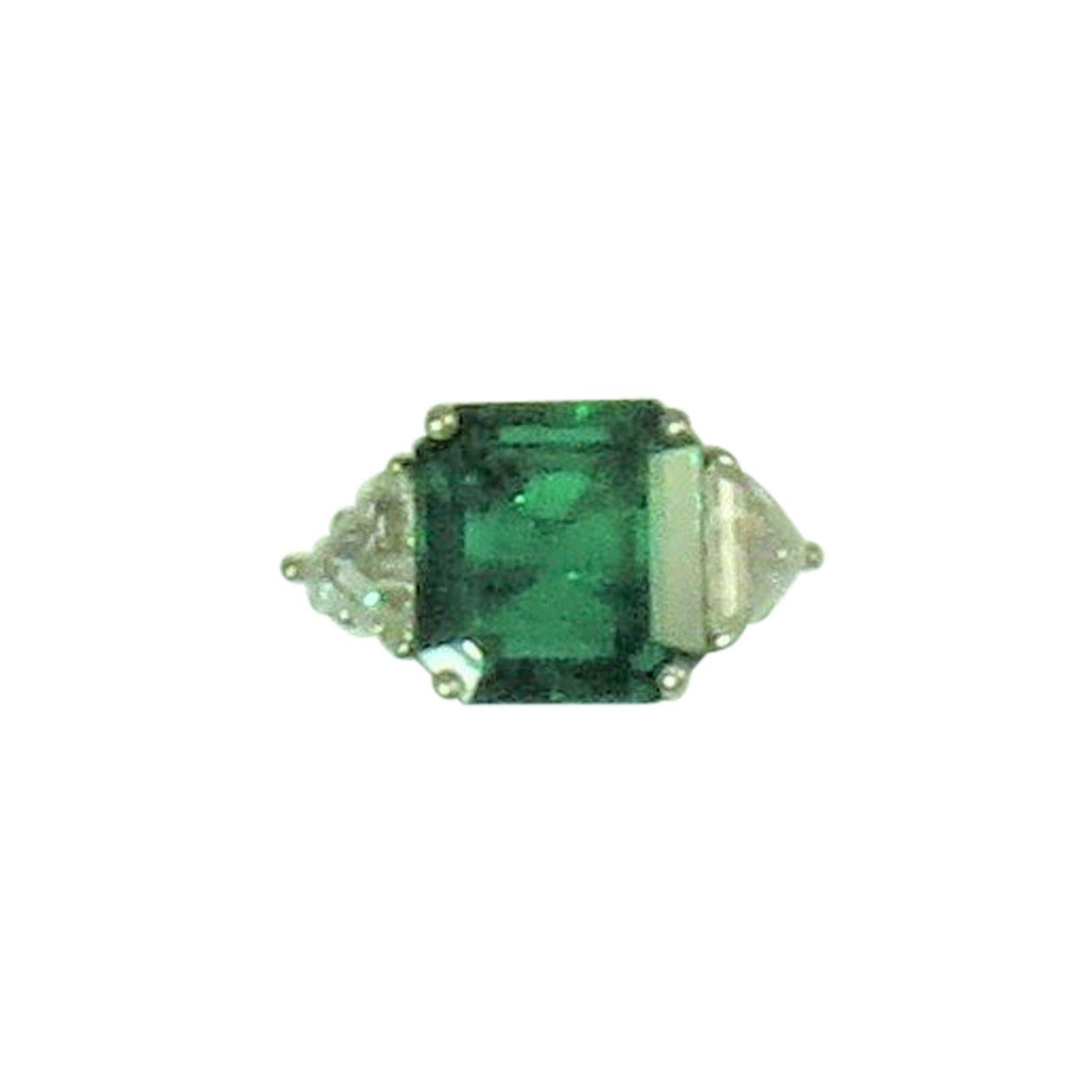 Emerald Cut Emerald and Triangular Diamond Platinum Ring For Sale