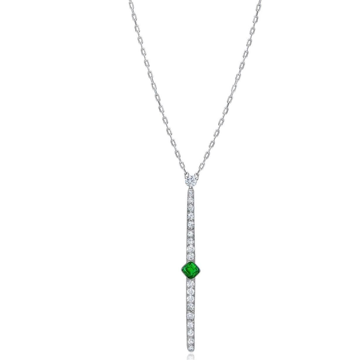 One- of- a - kind Mindi Mond New York Design from the Reconceived Collection.

1 natural Columbian Emerald, Cushion Step Cut 
bezel set 
Approx 0.75 Carat
Green color, strong saturation (very fine)

1 semi modern round brilliant cut diamond at