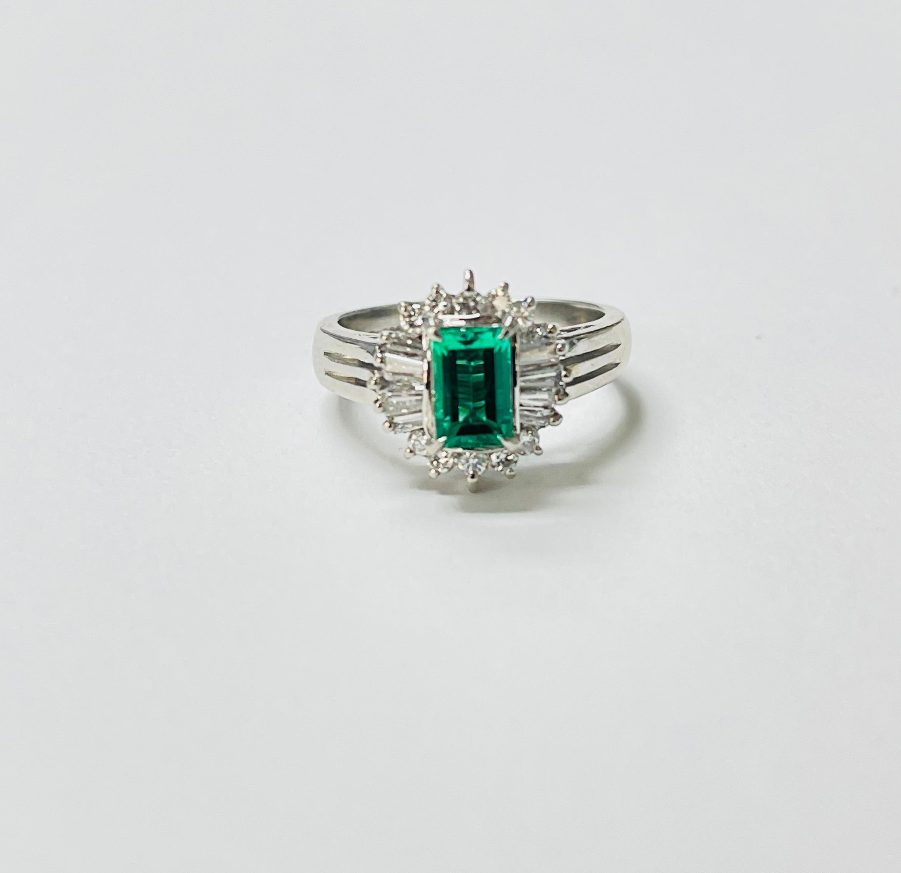Women's Columbian Emerald Octagonal Step Cut And Diamond Engagement Ring In Platinum GIA For Sale