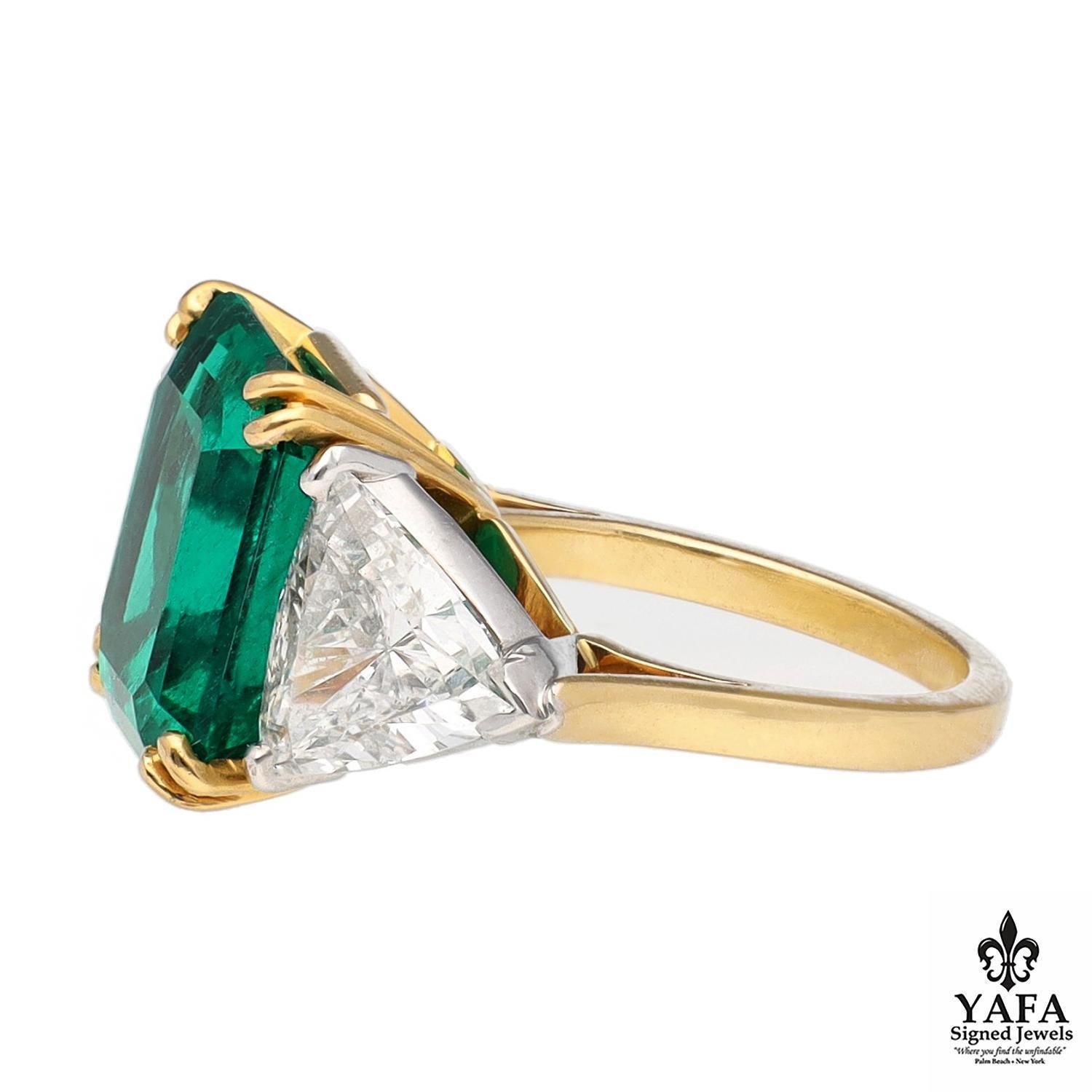 Platinum and 18K Yellow Gold Colombian Emerald and 2 - Triangular Shaped Diamond Ring.
Cleopatra is perhaps the most famous historical figure to cherish emerald gemstones. She even claimed ownership of all emerald mines in Egypt during her