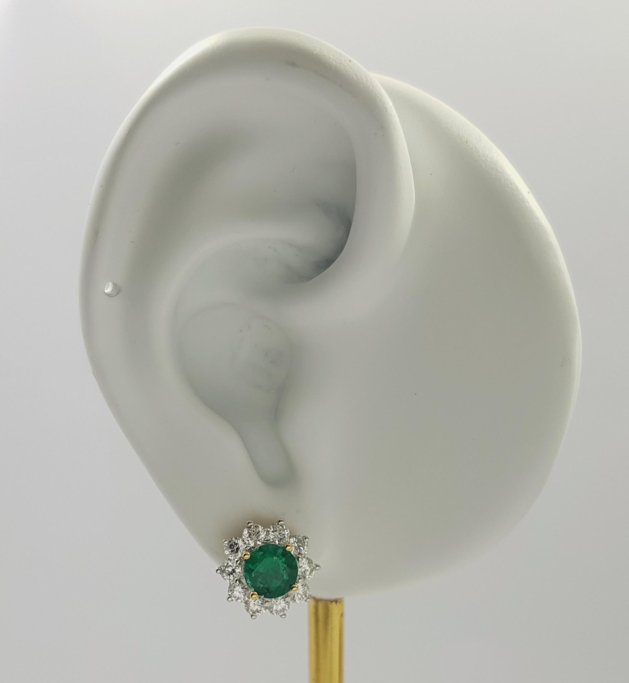 Columbian Emerald 1.50 carats with Diamond 1.28 carats Earrings set in 18K Gold Settings

Width: 1.2 cm 
Length: 1.2 cm
Total Weight: 5.07 grams

