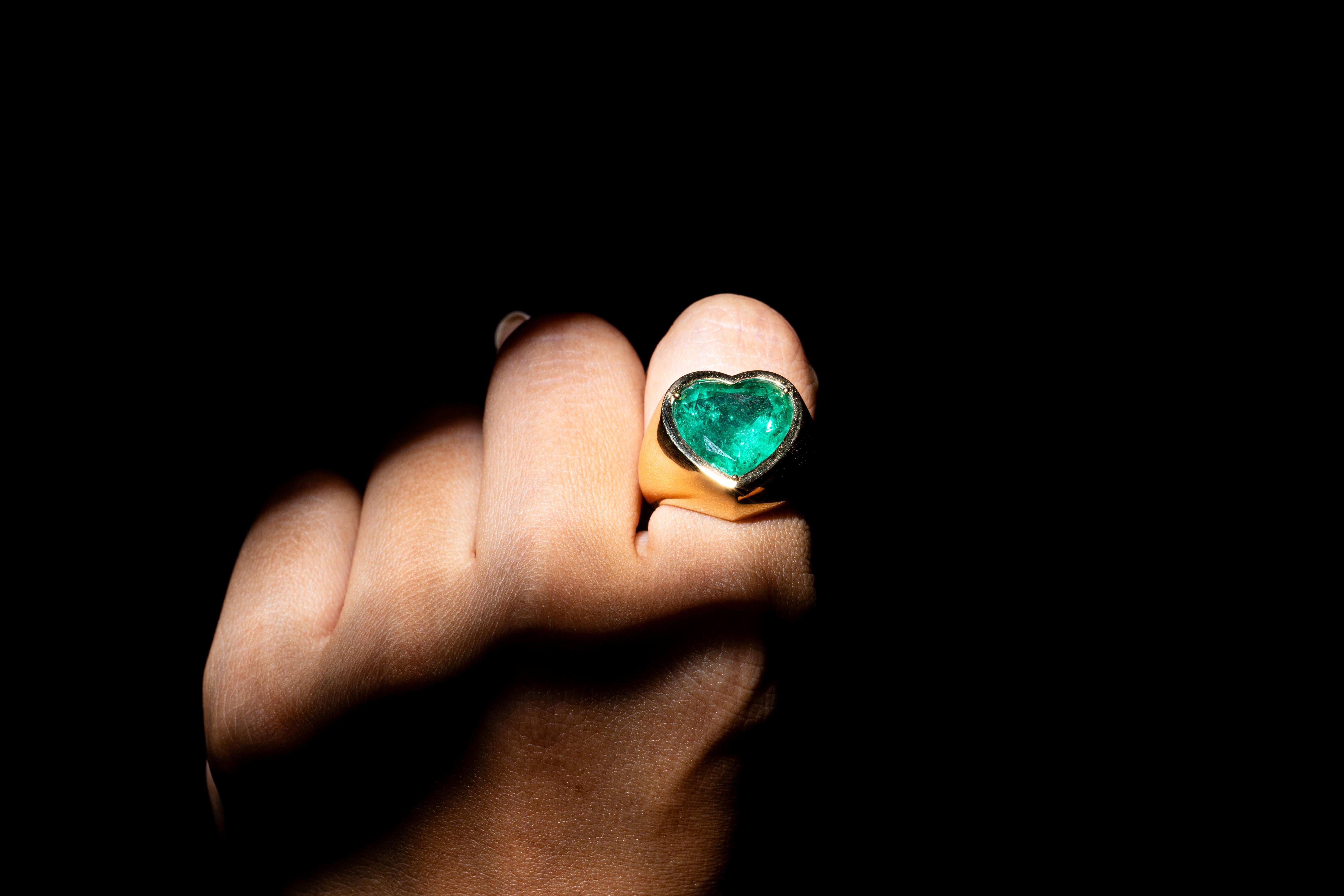 Certified beautiful clean columbian emerald (minor*) 
The stone is of investment grade with good luster and glowing vibrancy. A treasure to be had!
Heart shaped emerald mounted on 18 Karat yellow gold dome-style ring with smooth high polish. Mounted