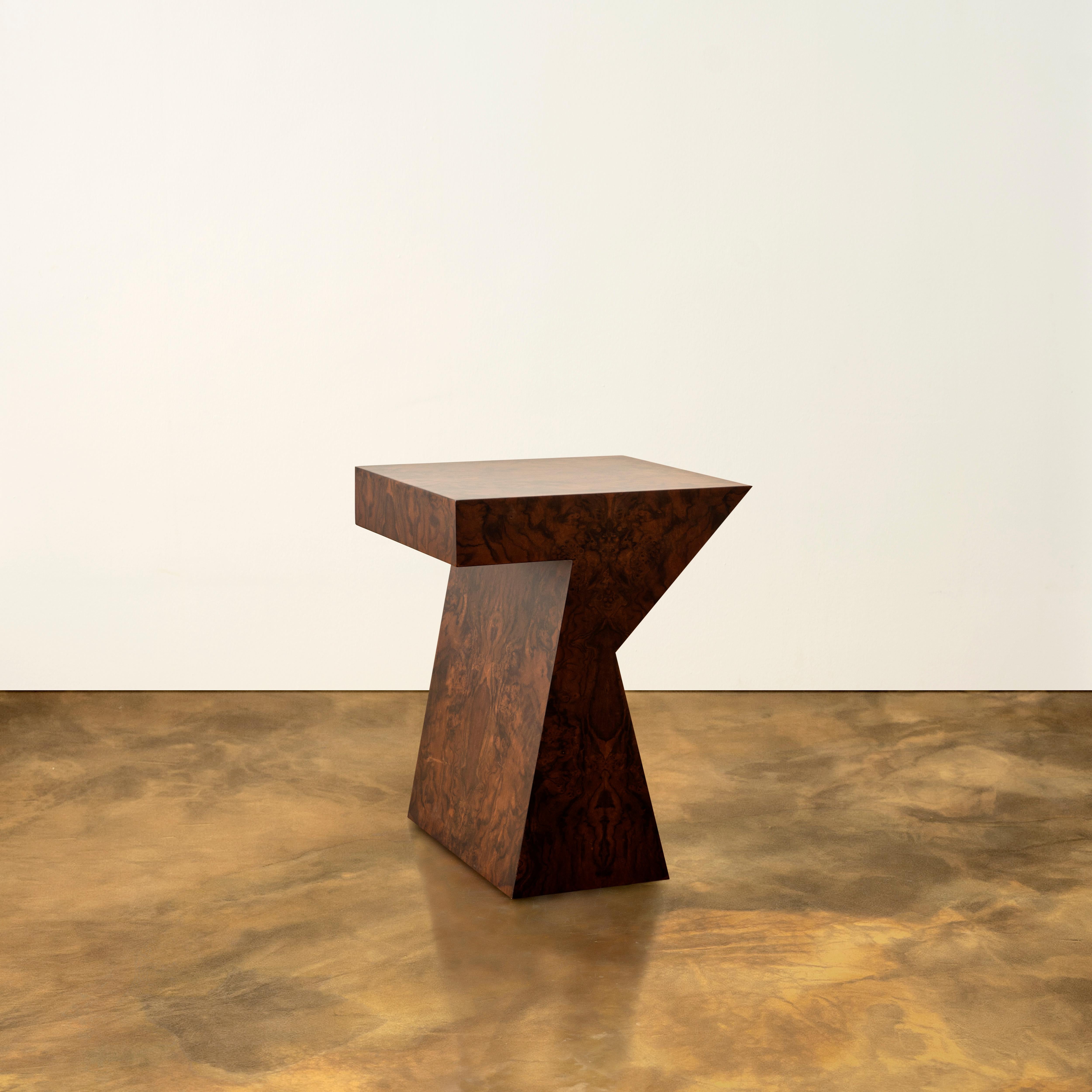 The perfectly scaled burled walnut side table Columbina is named after one of the leading female characters in Commedia dell’Arte. It’s sculptural form is driven from femininity inholding a masculine strength. This side table provides an assertive