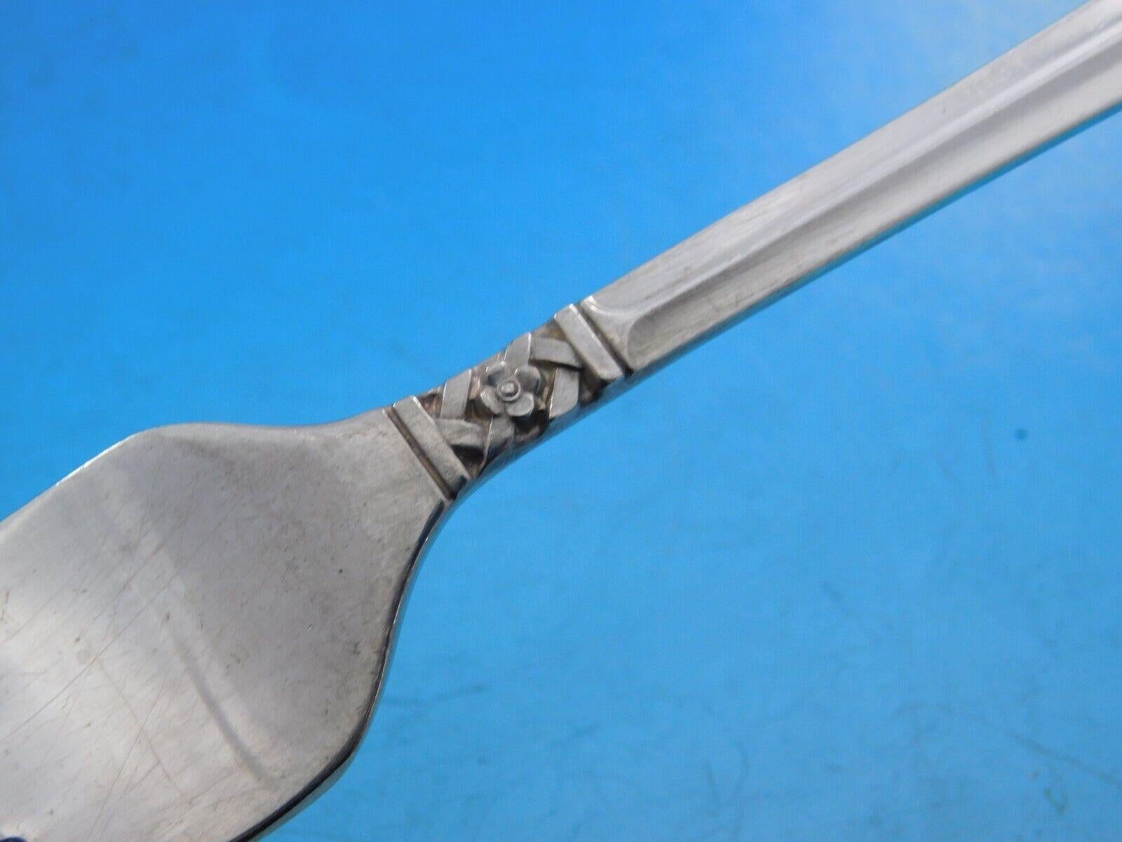 Columbine by Lunt Sterling Silver flatware set - 42 pieces. This scarce pattern features a unique woven, basket weave style design with floral detailing. This set includes:


8 Knives, 9