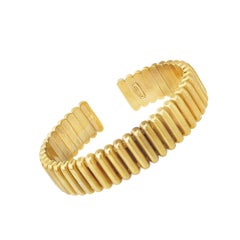 Pulsera Puño Columna en Oro Amarillo de 18k