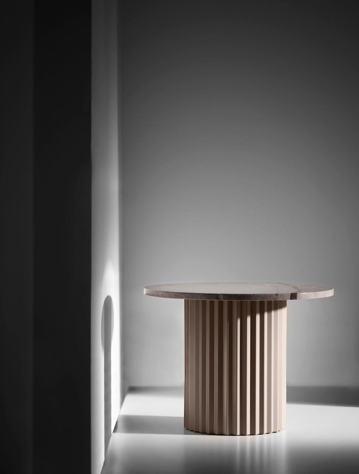 Column lounge table 60 by Lisette Rützou
Dimensions: D 60 x H 41 cm
Materials: Steel, Marble tabletop
Also available Ø 40

 Lisette Rützou’s design is motivated by an urge to articulate a story. Inspired by the beauty of materials, form and