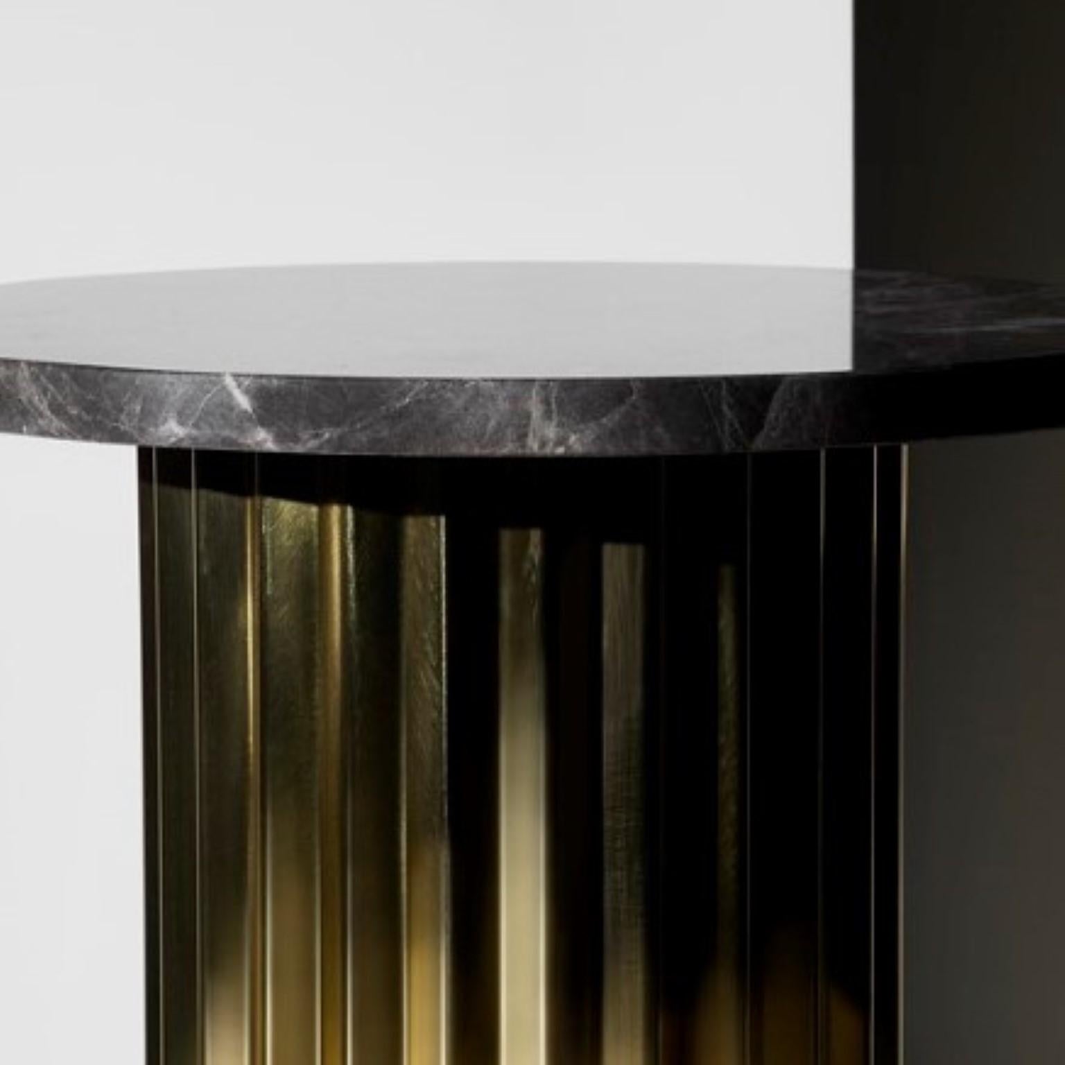 Column lounge table by Lisette Rützou
Dimensions: D 60 x H 41 cm
Materials: Brass column with marble tabletop
Also available Ø 40

 Lisette Rützou’s design is motivated by an urge to articulate a story. Inspired by the beauty of materials, form