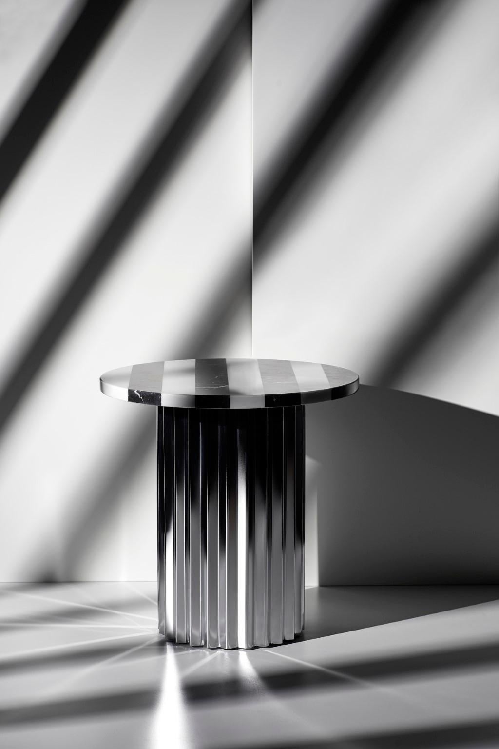 Column lounge table with marble 40 by Lisette Rützou
Dimensions: D 40 x H 41 cm
Materials: Marble
Also available in Ø 60

2Lisette Rützou’s design is motivated by an urge to articulate a story. Inspired by the beauty of materials, form and