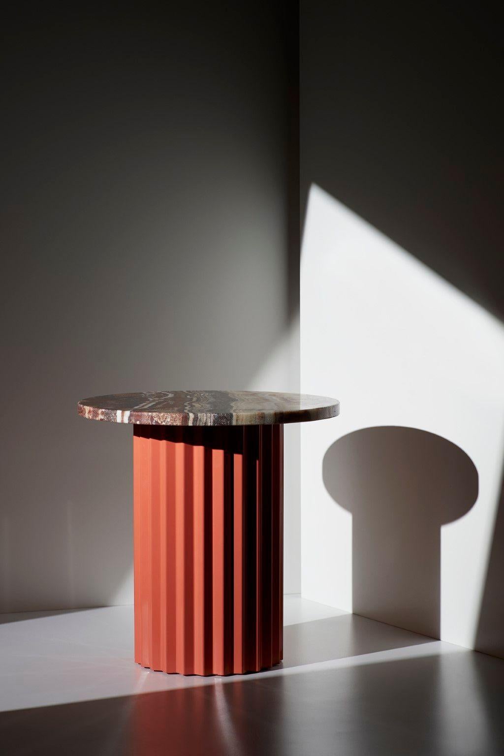 Column lounge table with Marble 40 by Lisette Rützou
Dimensions: D 40 x H 41 cm
Materials: Marble, Onyx
Also available in Ø 60

2Lisette Rützou’s design is motivated by an urge to articulate a story. Inspired by the beauty of materials, form