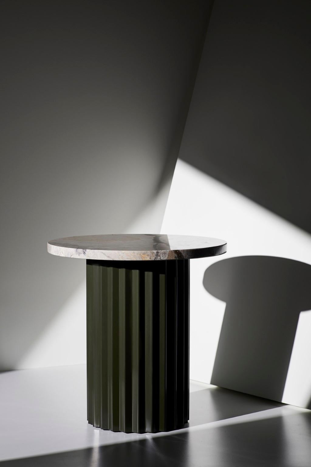 Column lounge table with marble 40 by Lisette Rützou.
Dimensions: D 40 x H 41 cm
Materials: Marble
Also available in Ø 60.

2Lisette Rützou’s design is motivated by an urge to articulate a story. Inspired by the beauty of materials, form and