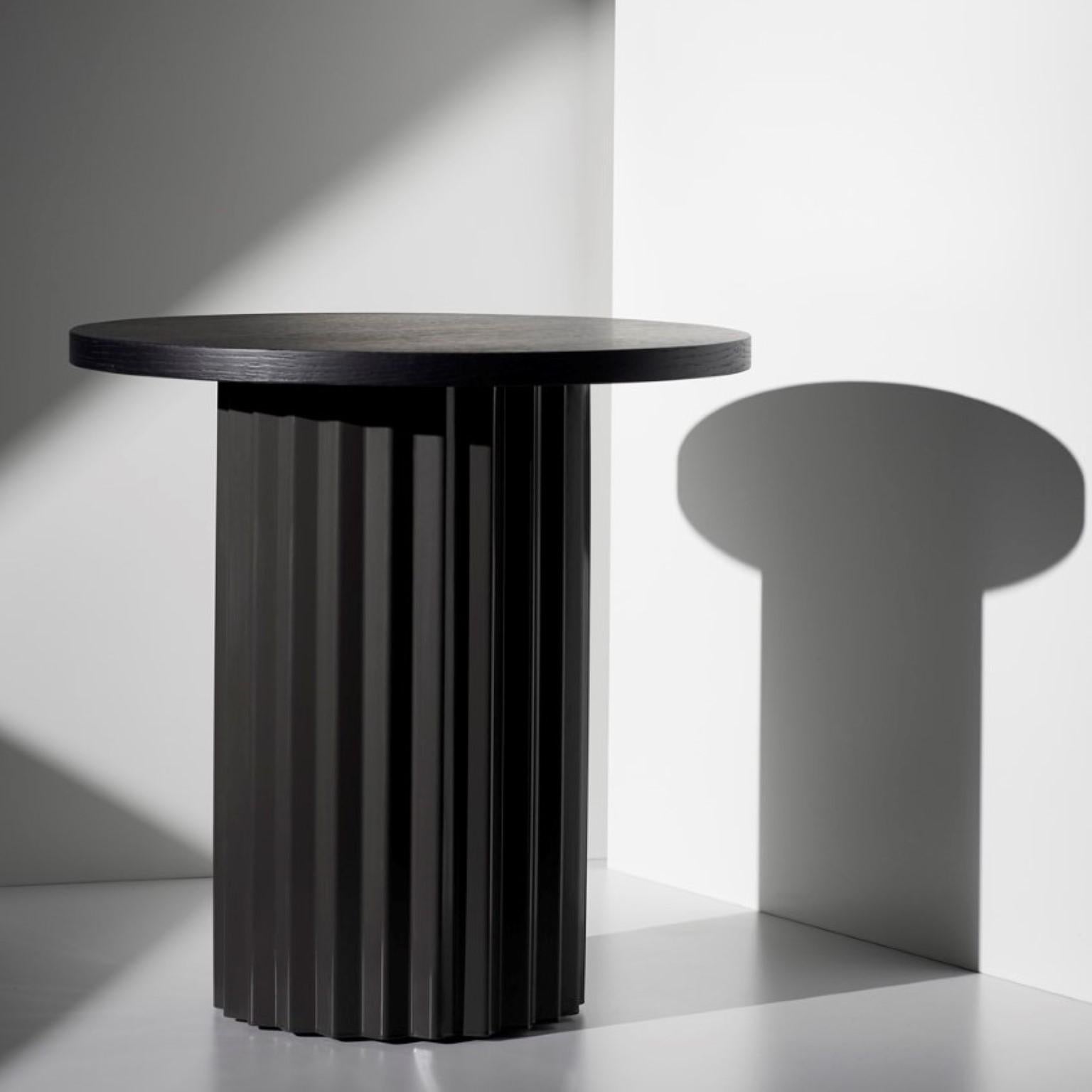 Column lounge table with oak 40 by Lisette Rützou
Dimensions: D 40 x H 41 cm
Materials: Column with black tained oak tabletop
Also available in Ø 60

Lisette Rützou’s design is motivated by an urge to articulate a story. Inspired by the beauty