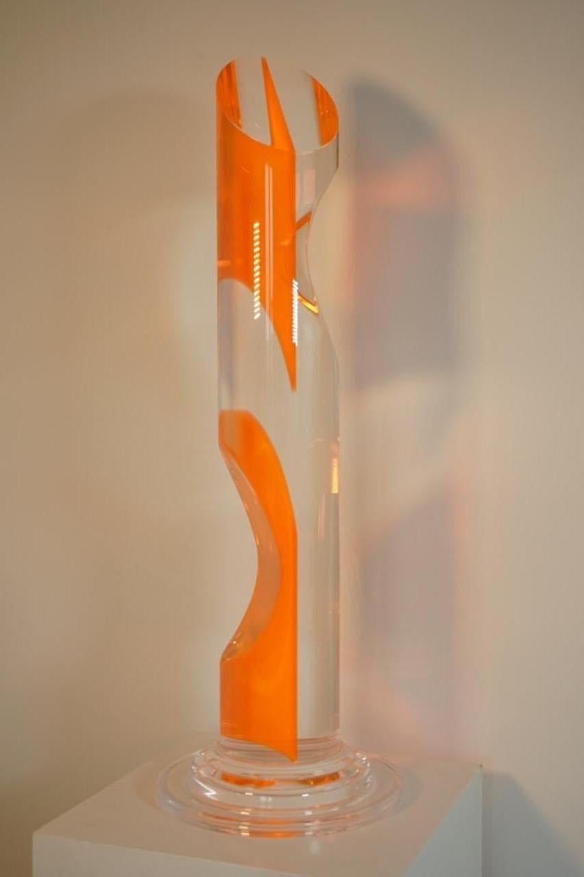 Transparent and orange plexiglass sculpture.
Base size: Diameter 36 cm.
 