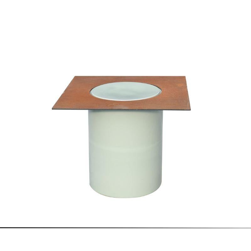 Column side table by WL Ceramics
Design: David Derksen
Materials: Porcelain, celadon glaze, corten steel
Dimensions: 50 x 50 x 40 cm / 40 x 30 (ceramic)

Also available: column low table.

Porcelain cylinders and corten steel plates form the
