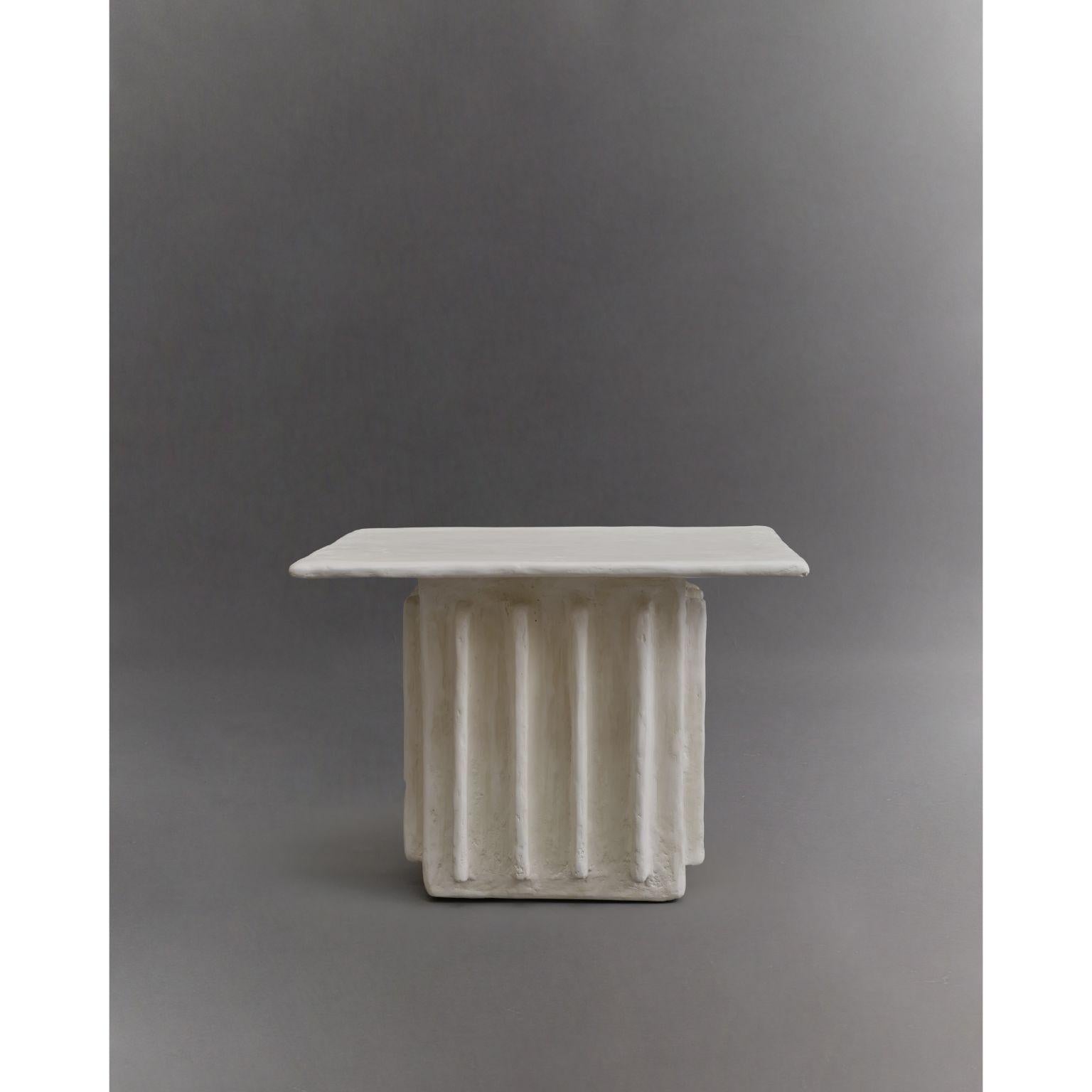 Columnar side table by Ombia
Dimensions: W 42 x D 33 x H 43.5 cm
Materials: White raw plaster finish. 
Custom colors upon request. 


Ombia is a ceramic sculpture and design studio based in Los Angeles. The name and its roots originates from