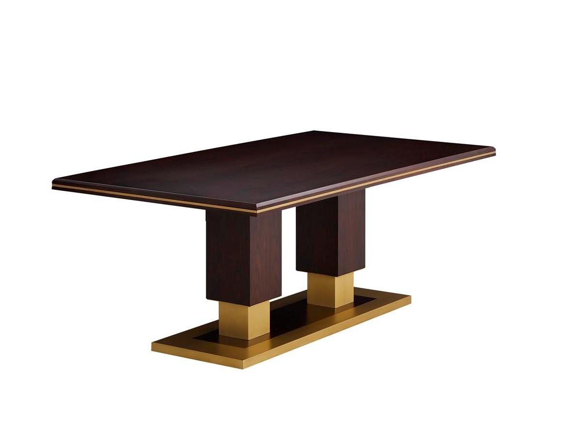 Ecletic and very elegant, this dining table embraces sensuality in decoration, combining wood and metal textures and keeping the balanced design.

Matte Eucalyptus Fumé veneer top and brushed brass base and trimmings.
  