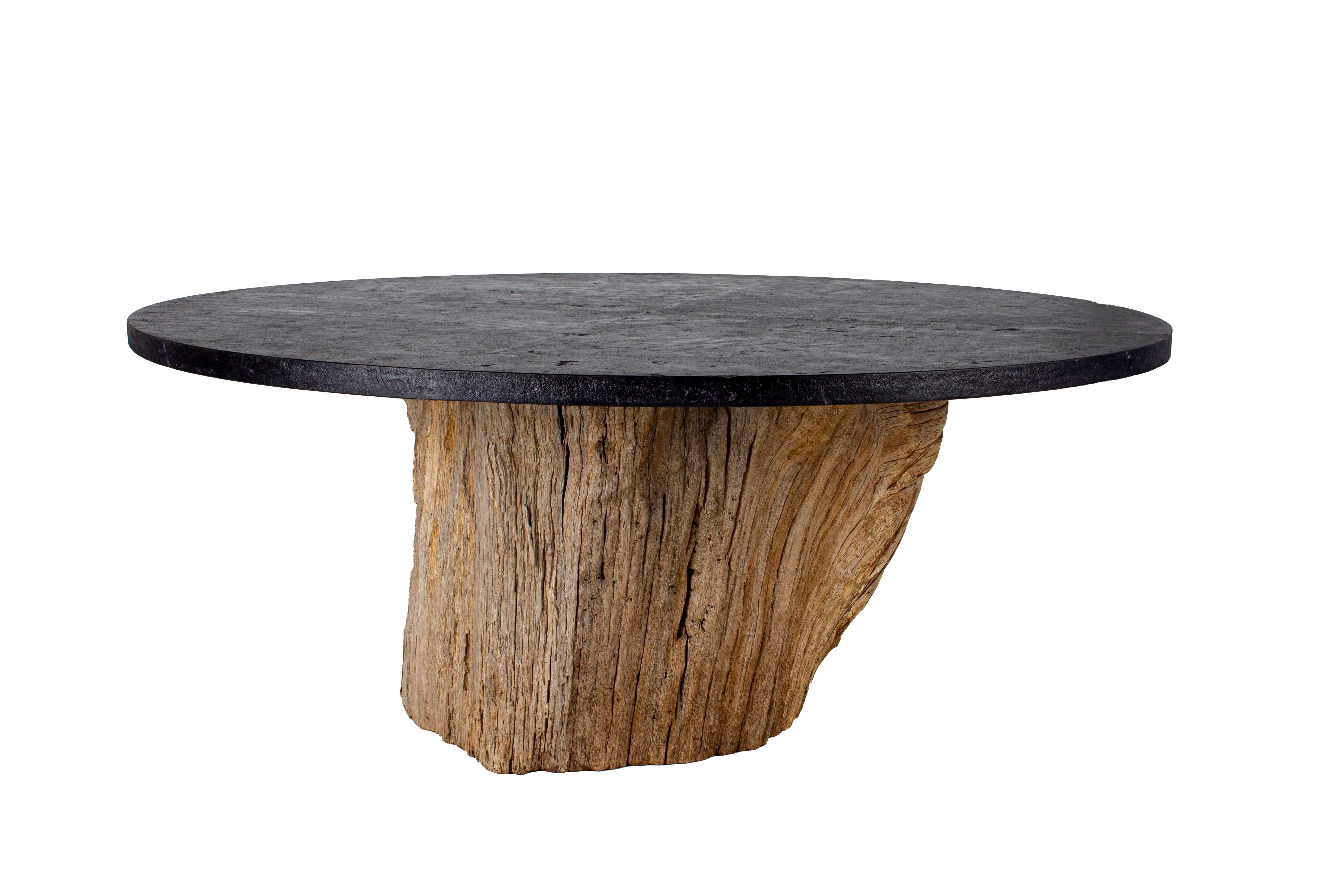 Organic form dining table. Weathered oak trunk base from Bass Farm in Eastern North Carolina. As a fallen tree it was harvested from the old growth hardwood bottom lands of the farm, a swampy section never cut for timber production. The tree is in