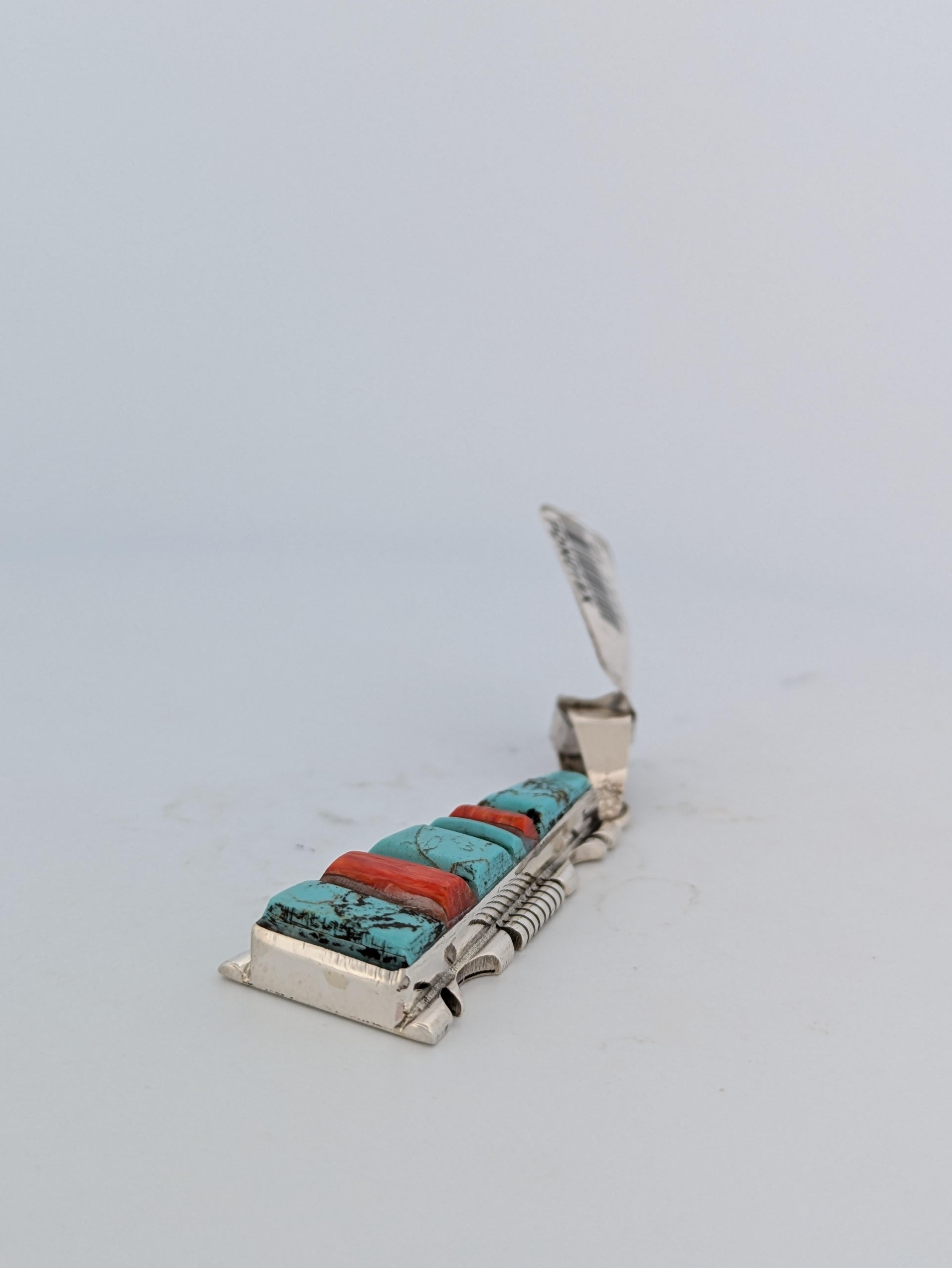 New Native American handmade sterling silver and turquoise, coral cobblestone inlay pendant with hand cut out design by Navajo artist Steve Francisco.

Discover the artistry of Native American jewelry with this stunning handmade sterling silver