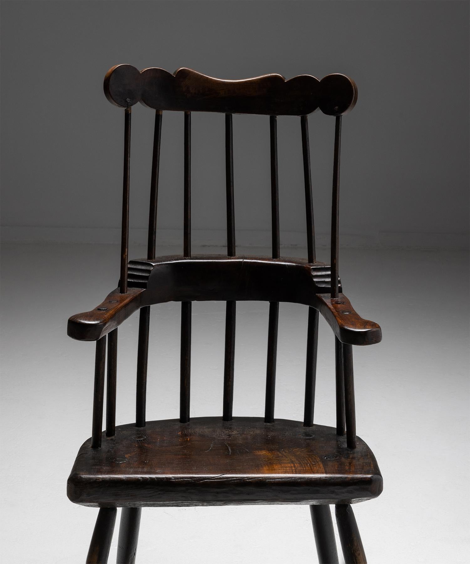 Comb-back windsor

Wales circa 1860

Carved wooden frame with spindle back and slab seat. Beautiful dark patina.

Measures: 22.5”W x 20”D x 41”H x 16”seat.