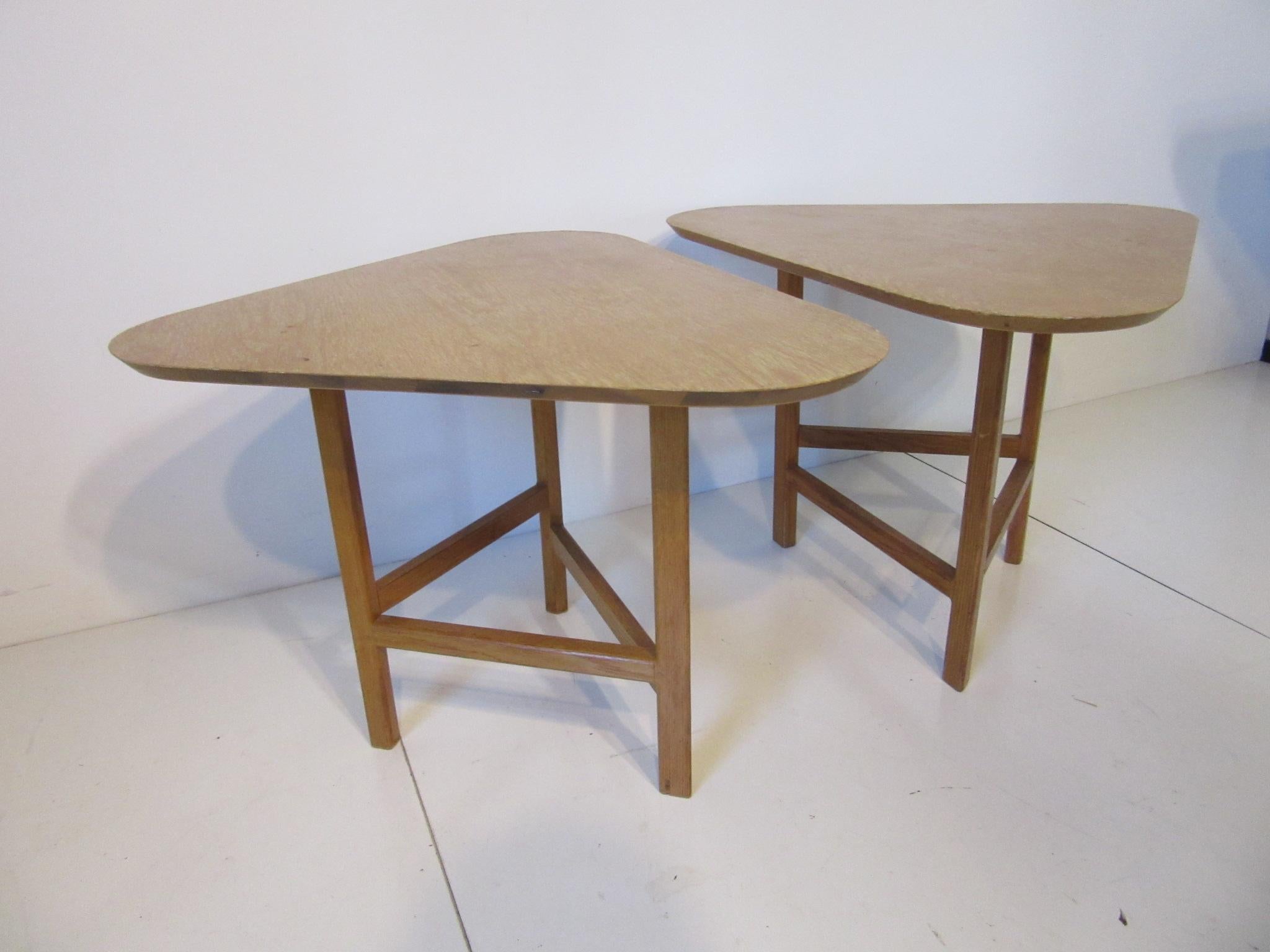 A pair of rare handcrafted side tables with combed oak tops and solid oak legs and stretchers constructed by known artist , designer and furniture builder Molly Gregory (1914-2006). Molly was a pioneer in the art of American Studio furniture as the