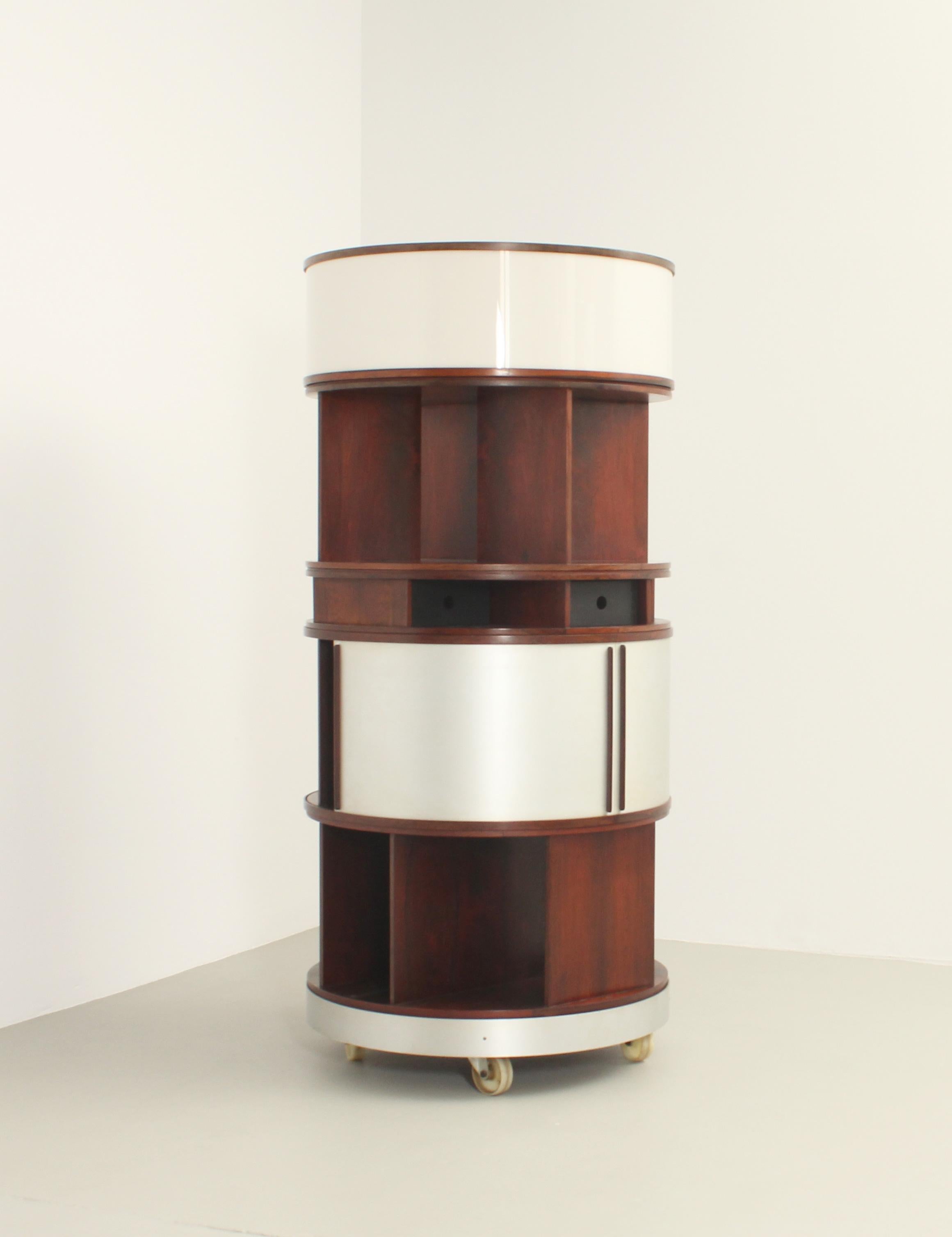 Combi Center storage unit designed in 1963 by Joe Colombo for Bernini, Italy. Large version with built-in lighting. Hardwood, acrylic, lacquered wood and brushed aluminum. Awarded a Silver Medal at the XIII Triennale di Milano in 1964.