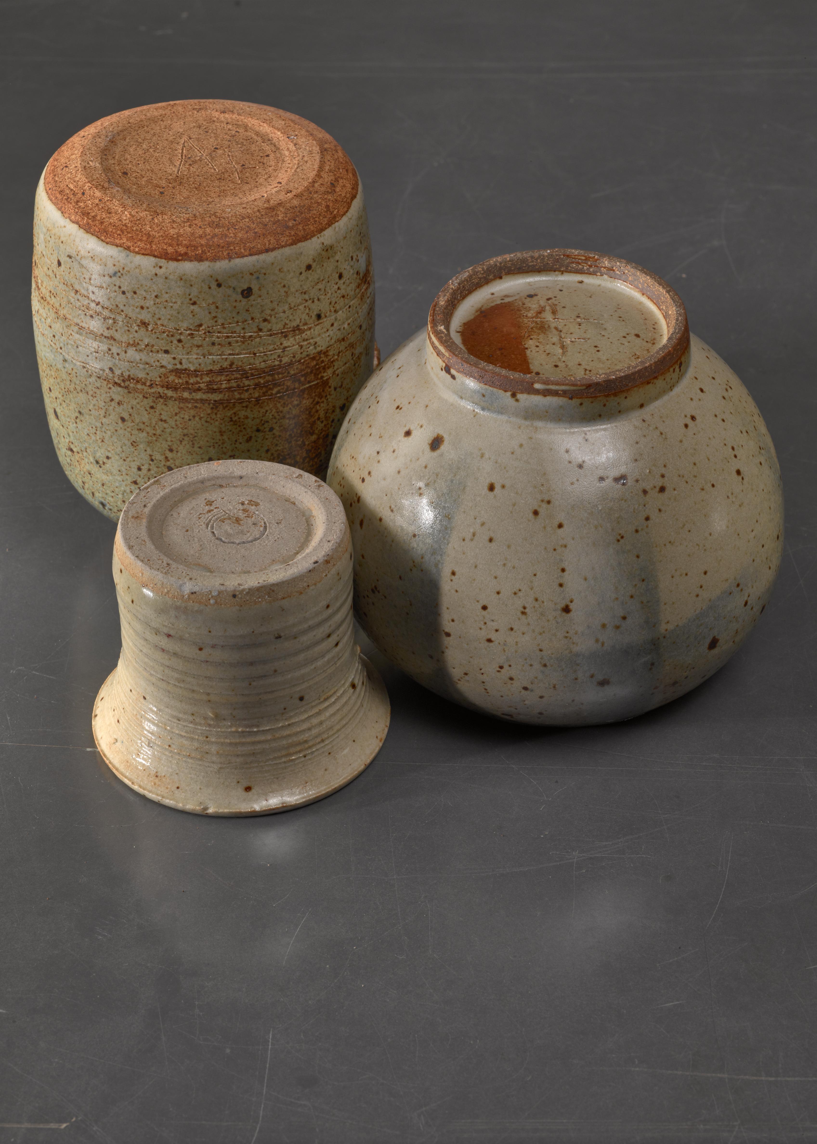A combination of three Franco Agnese ceramic pieces; an ikebana vase, a small vase and a small jar in greystone.

Beautiful composition in itself that can be enhanced with some small flowers or plants.

The measurements stated are of the