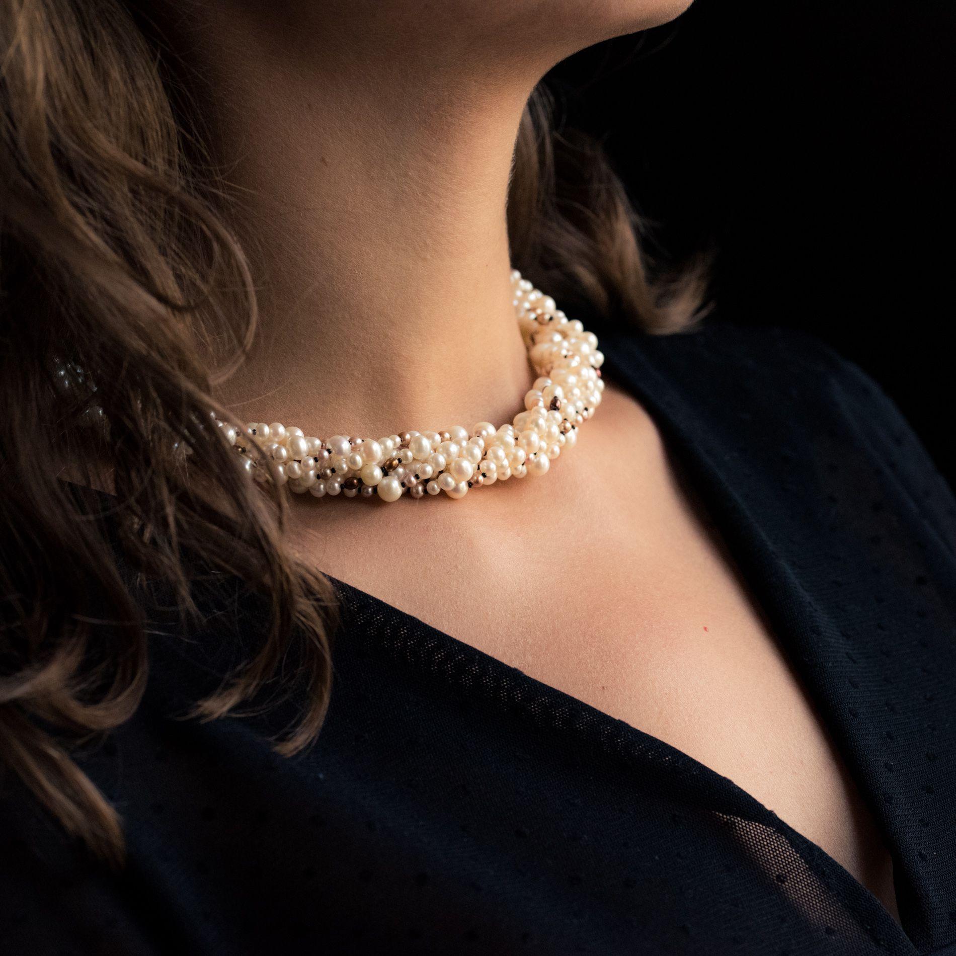 long pearl necklace with brooch