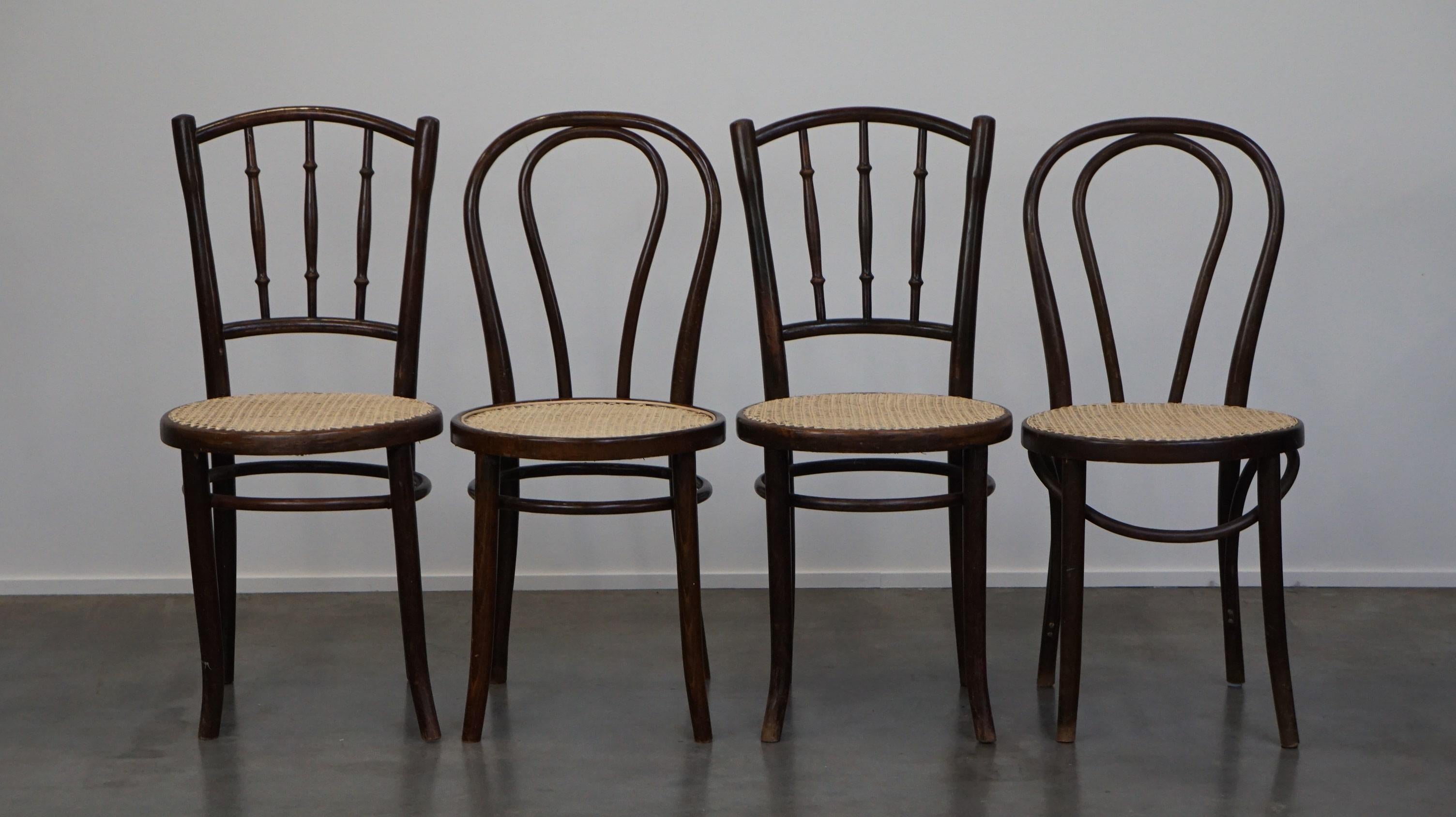 This beautiful set of Thonet chairs/dining chairs is super charming because as a combined set they have a playful look. The chairs have new hand-matte seats and they are still in good condition. For their age, they have normal signs of use and, as