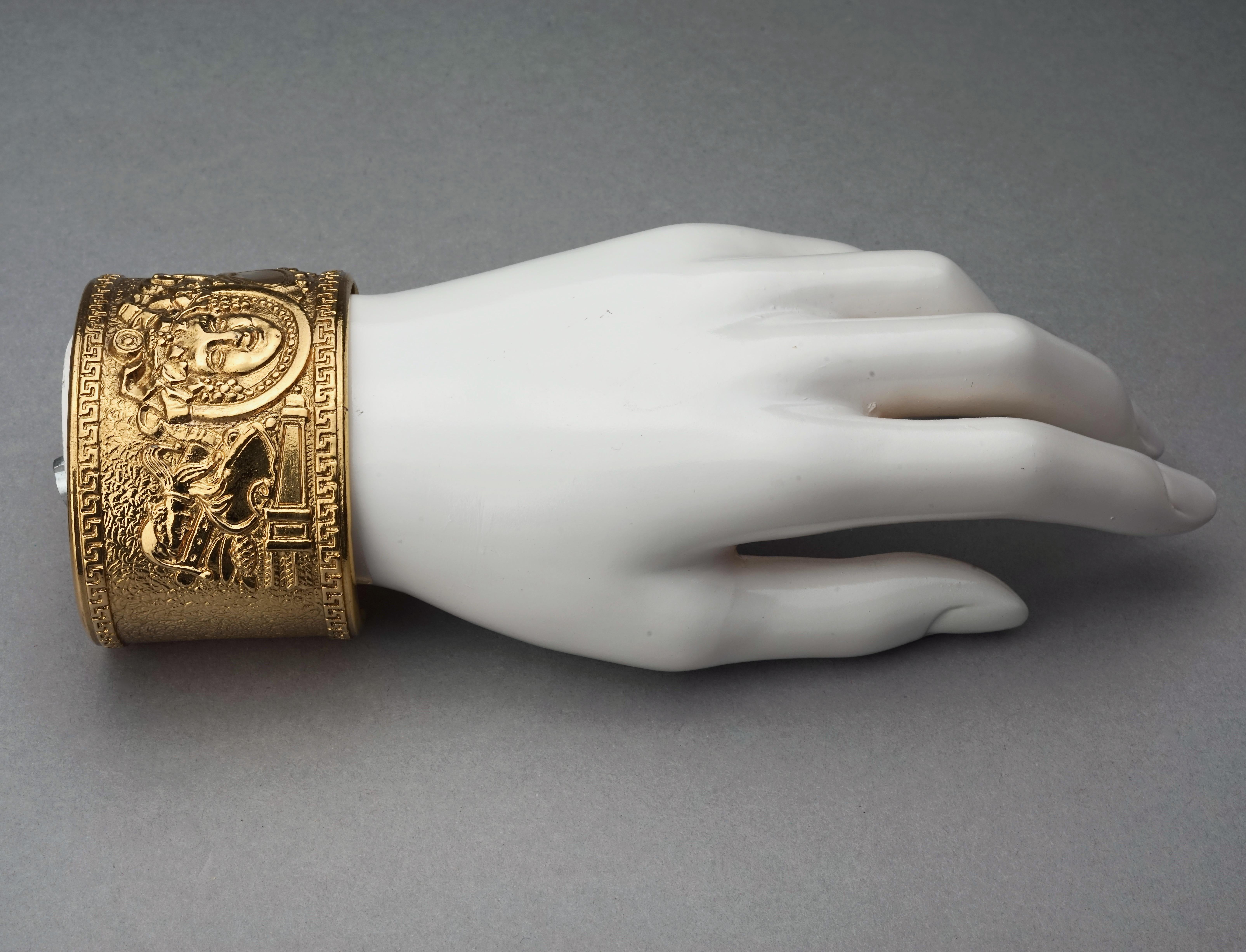 COMEDIE FRANCAISE Bacchus Figural Cuff Bracelet Attributed to Christian Lacroix 

Measurements:
Height: 1.77 inches (4.5 cm)
Inner Circumference: 6.88 inches (17.5 cm) including the opening

Features:
- 100% Authentic COMEDIE FRANCAISE attributed to