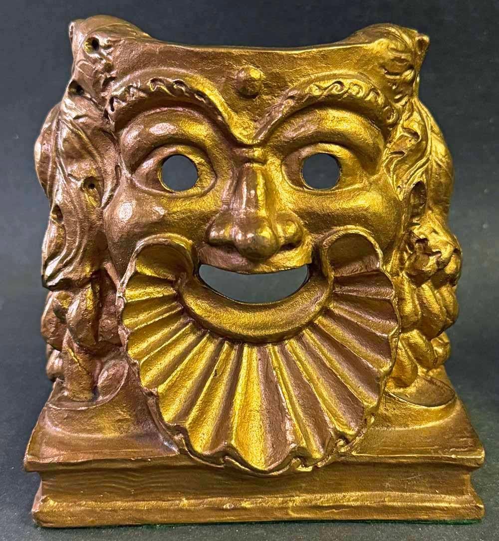Extremely rare, perhaps unique, this stunning pair of gilded bronze bookends depict the ancient figures of Comedy and Tragedy in a modern way, each head poised on a closed book to indicate its purpose.  The sculptor was Frederic Allen Williams, who