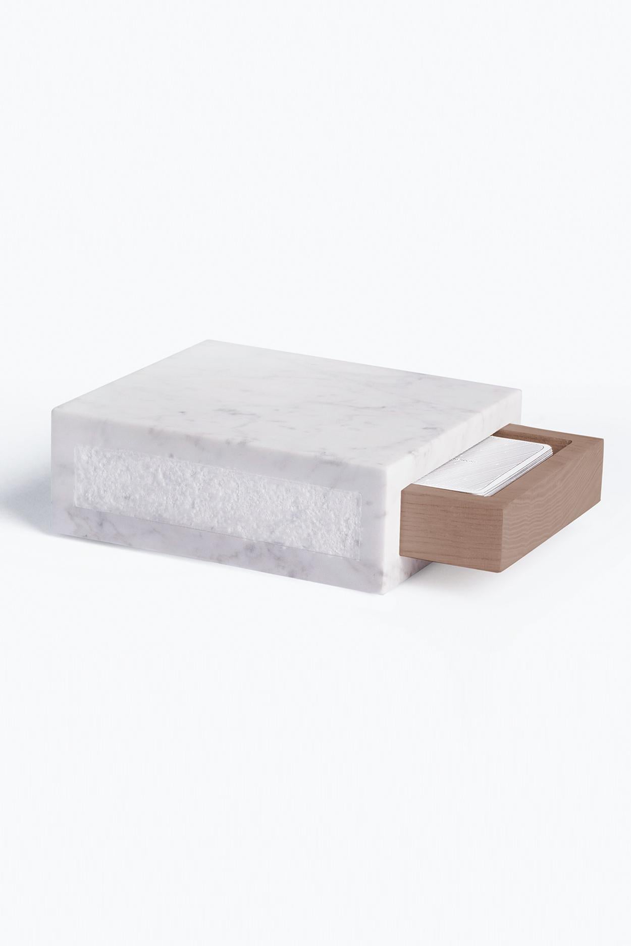 A reference to one of the most characteristic uses of marble and to the territory of origin of Studio Lievito, this package recalls the box where the lard is stored during its seasoning. Fashioned of white Carrara marble with a sliding mahogany