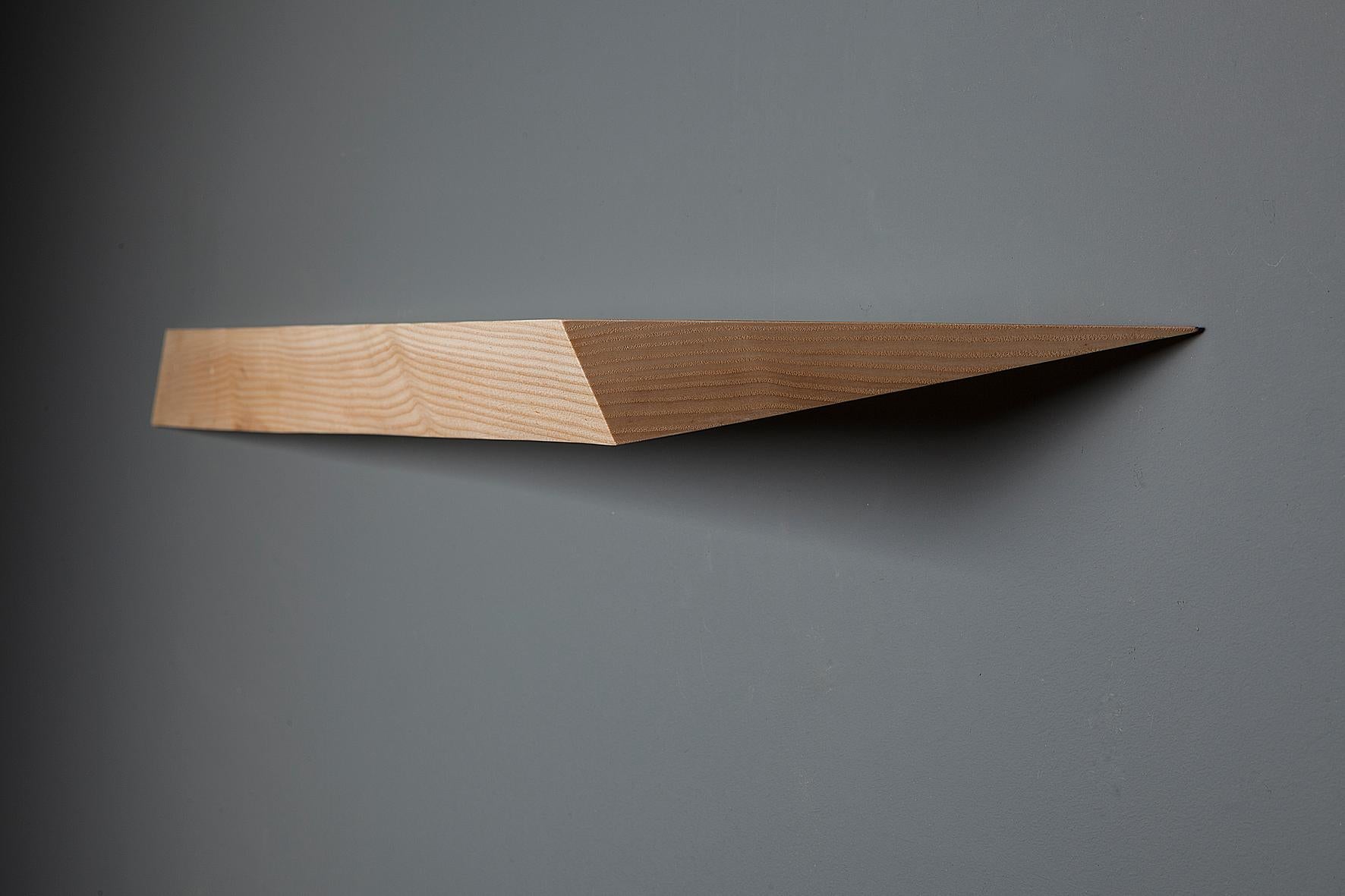 Comet catches the movement of light across the sky, in this angular, twisting floating shelf, which along with Corona, features in the Celestial Series. Its tapering form creates a sense of curiosity as to how the piece can be suspended and still