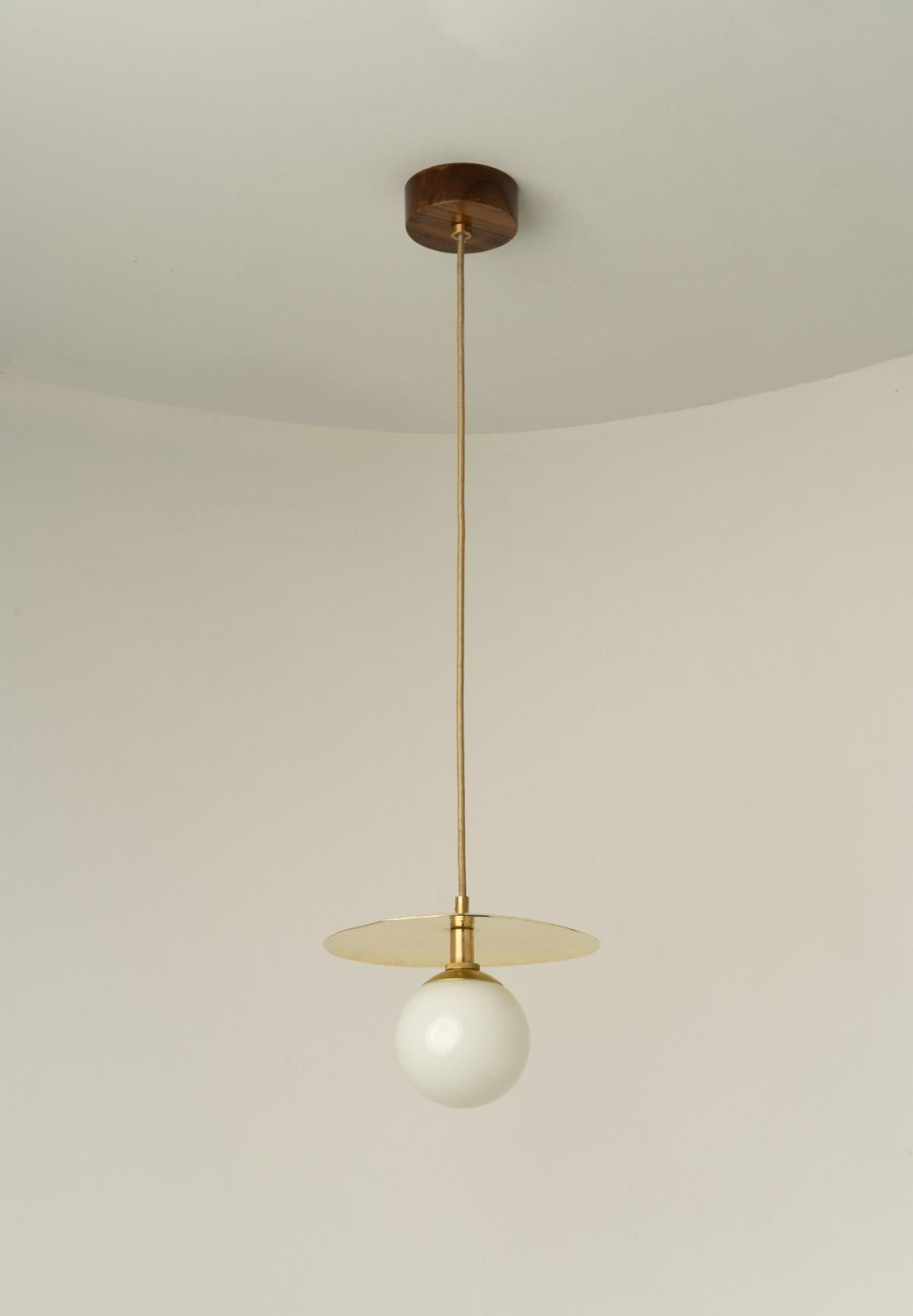Vitra Pendant Lamp by Isabel Moncada
Dimensions: D 30 x H 100 cm.
Materials: Brass, Glass.

Available in different colored blown glass globes. All our lamps can be wired according to each country. If sold to the USA it will be wired for the USA for