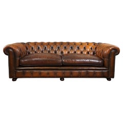 Comfortable 2.5-seater Chesterfield sofa crafted from quality cowhide leather