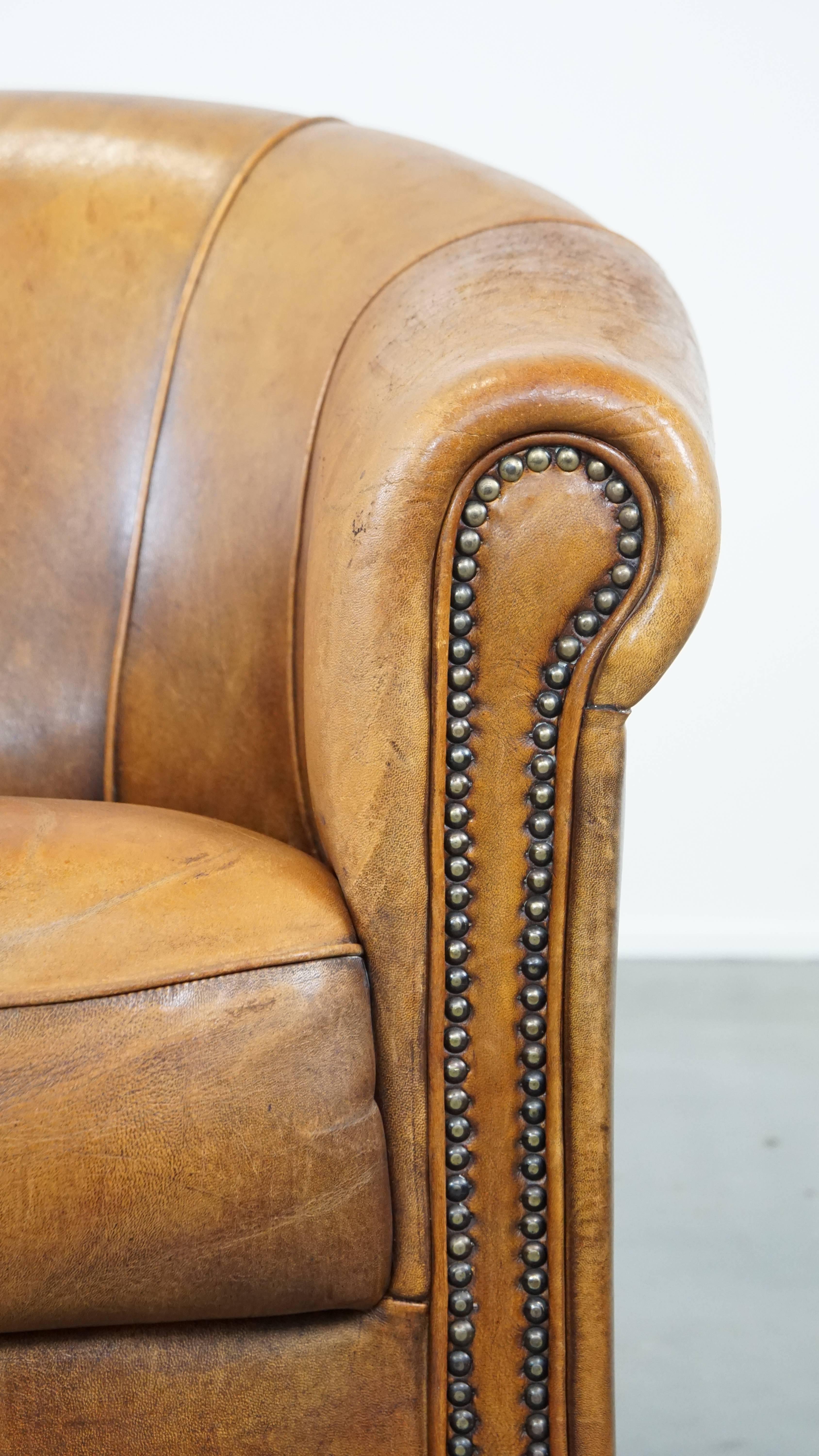 Comfortable and charming, sturdy sheep leather club armchair in a cognac color For Sale 5