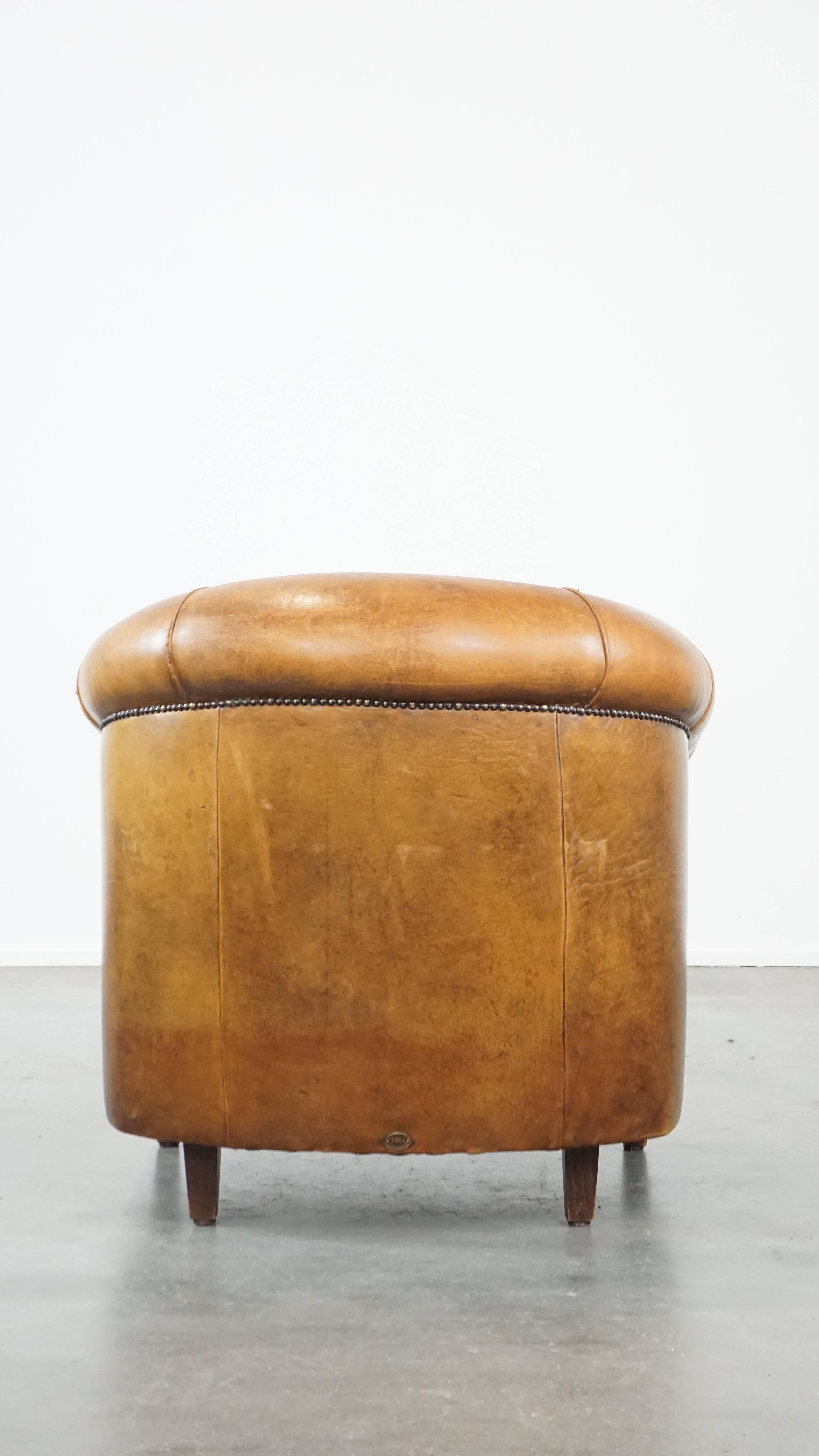 Comfortable and charming, sturdy sheep leather club armchair in a cognac color In Fair Condition For Sale In Harderwijk, NL
