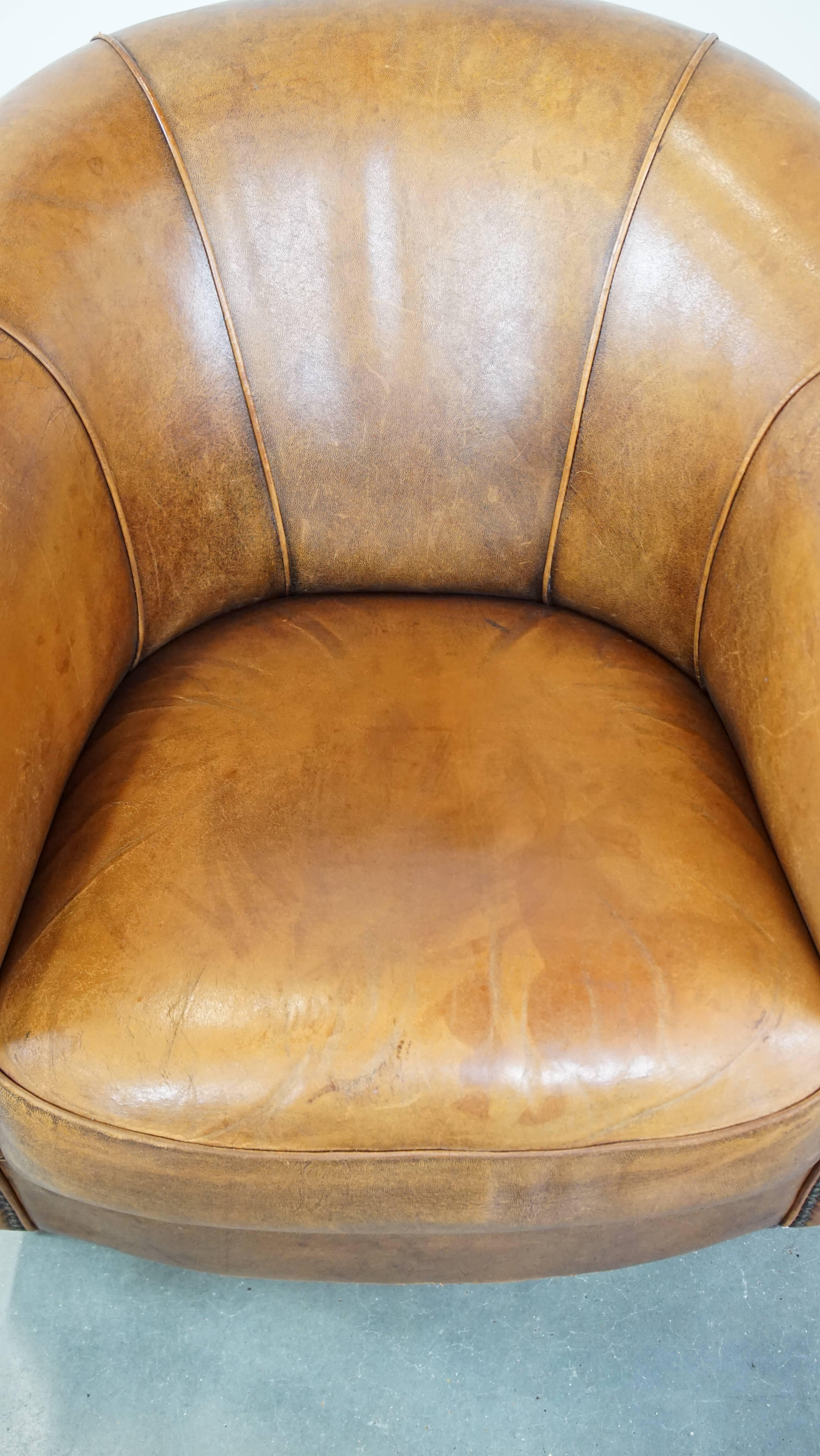 Sheepskin Comfortable and charming, sturdy sheep leather club armchair in a cognac color For Sale