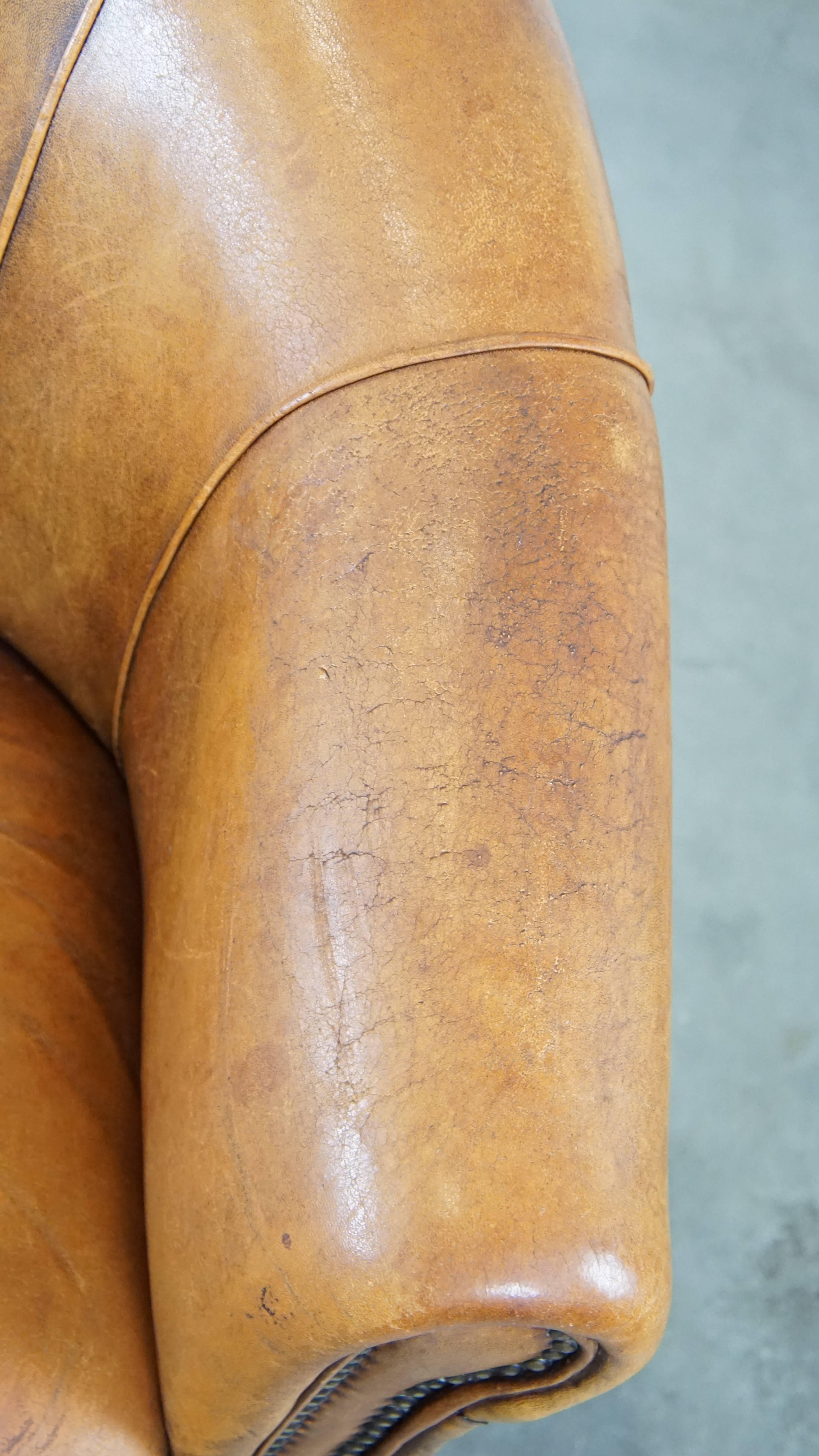 Comfortable and charming, sturdy sheep leather club armchair in a cognac color For Sale 2