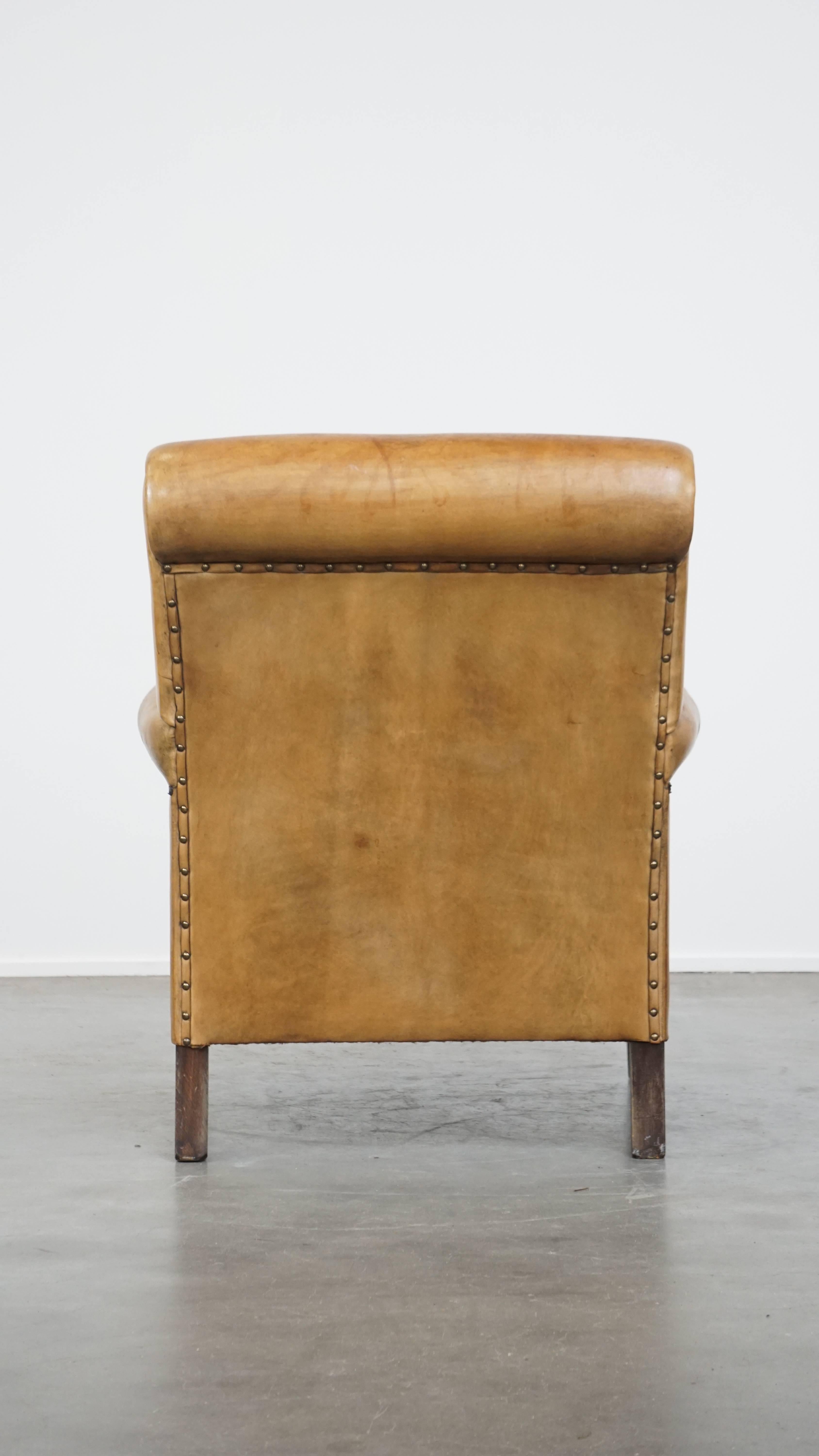 Hand-Crafted Comfortable and stylish vintage sheepskin leather armchair For Sale