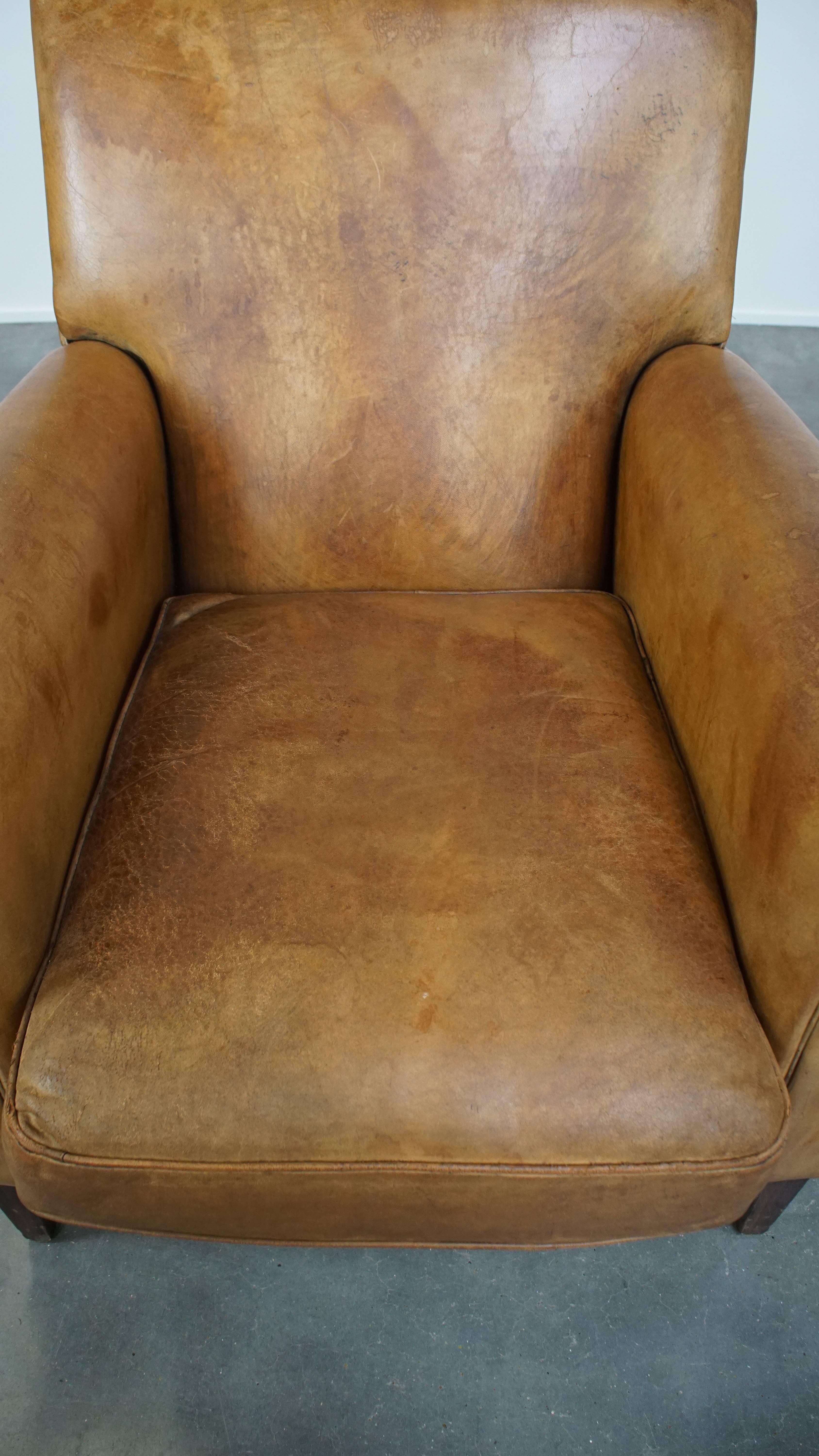 20th Century Comfortable and stylish vintage sheepskin leather armchair For Sale
