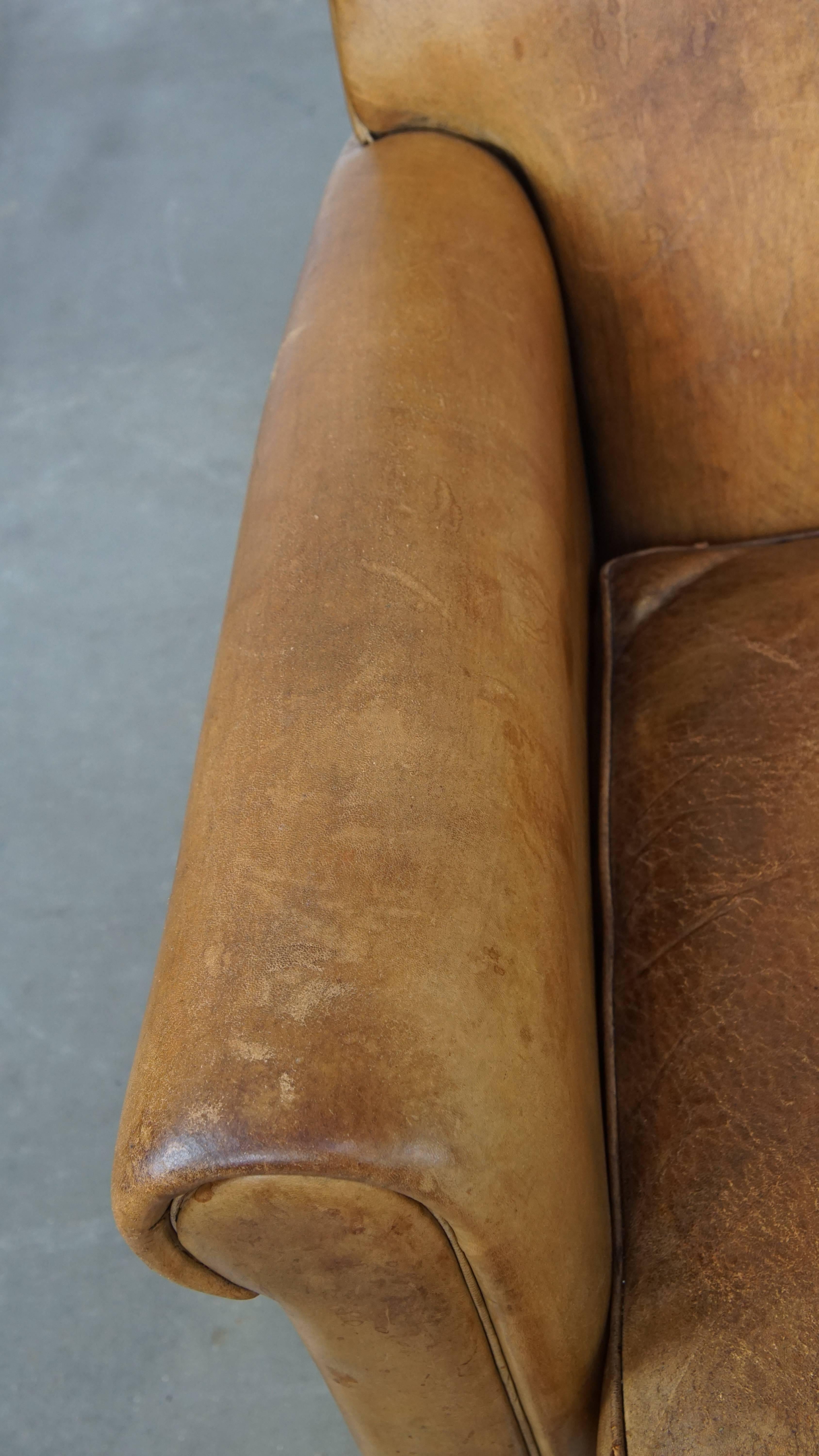 Leather Comfortable and stylish vintage sheepskin leather armchair For Sale